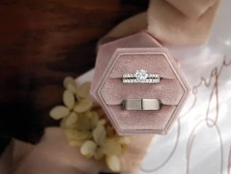 Matching wedding bands. A photo showcasing a white gold engagement ring, matching wedding band, and a classic men's wedding ring