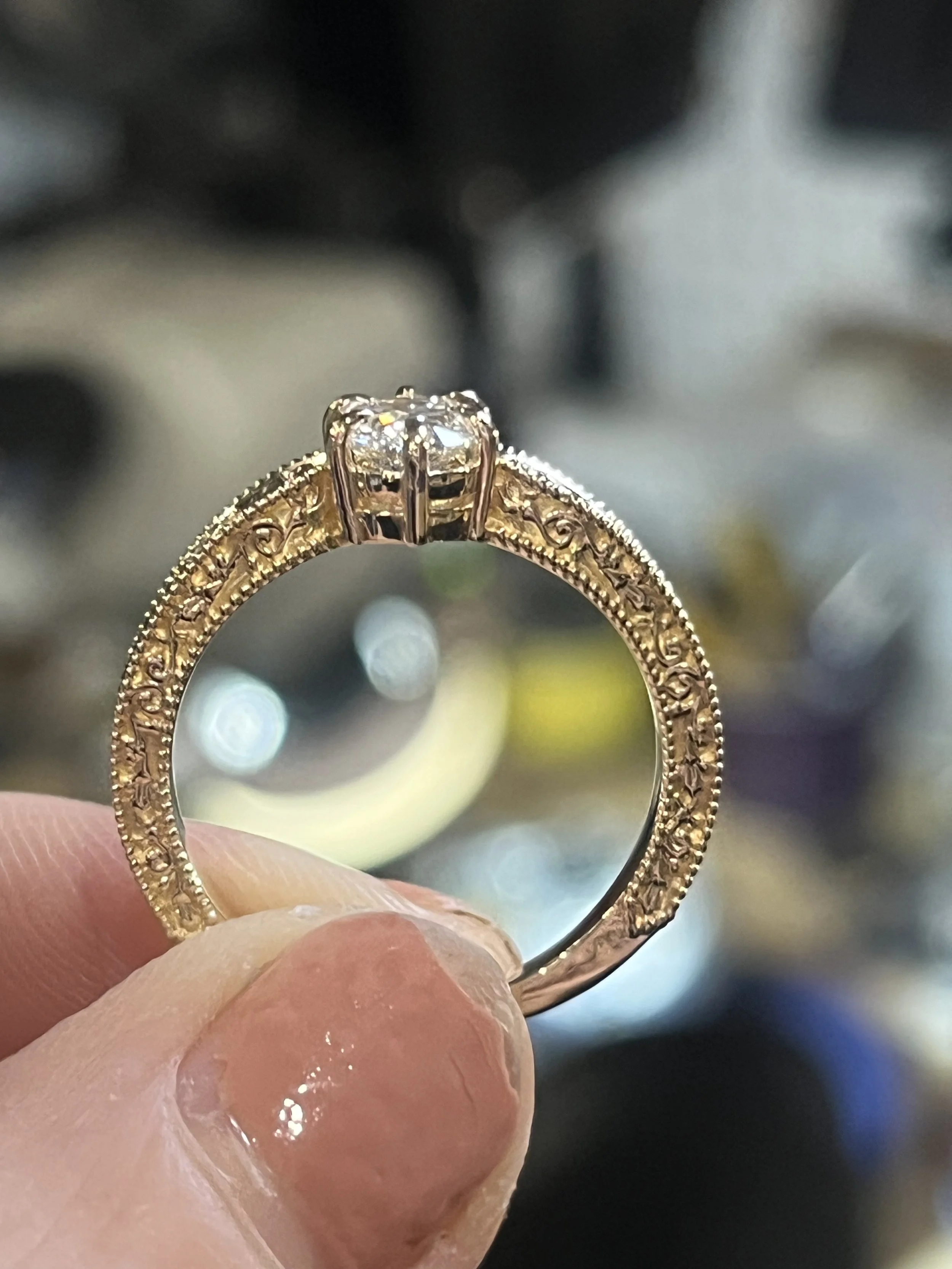 Close-up of a decorative gold ring custom made by TSC Jewelry in Hartville Ohio