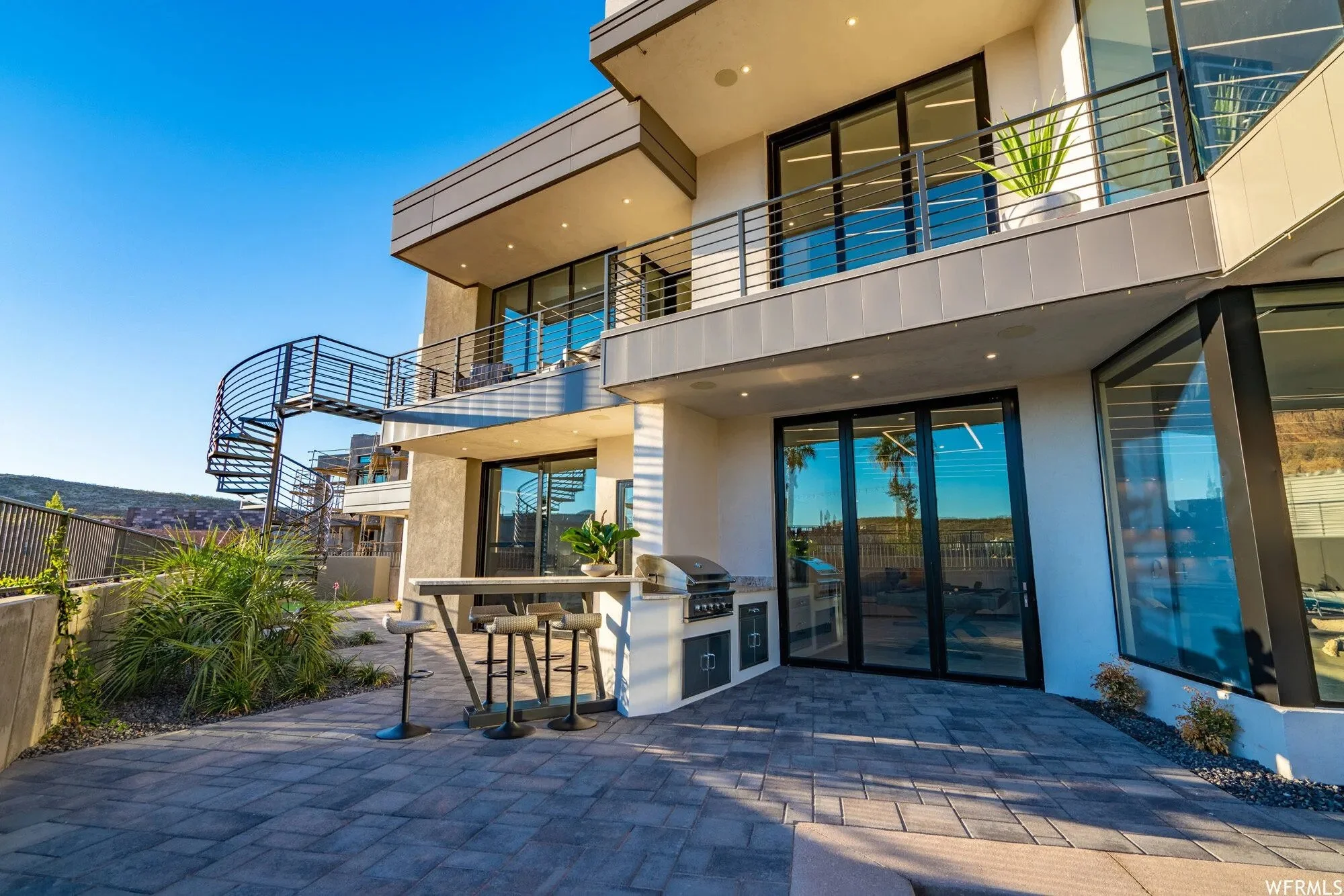 Thermally broken aluminum bi-fold doors in use, illustrating their practicality for open-concept living and outdoor entertaining.