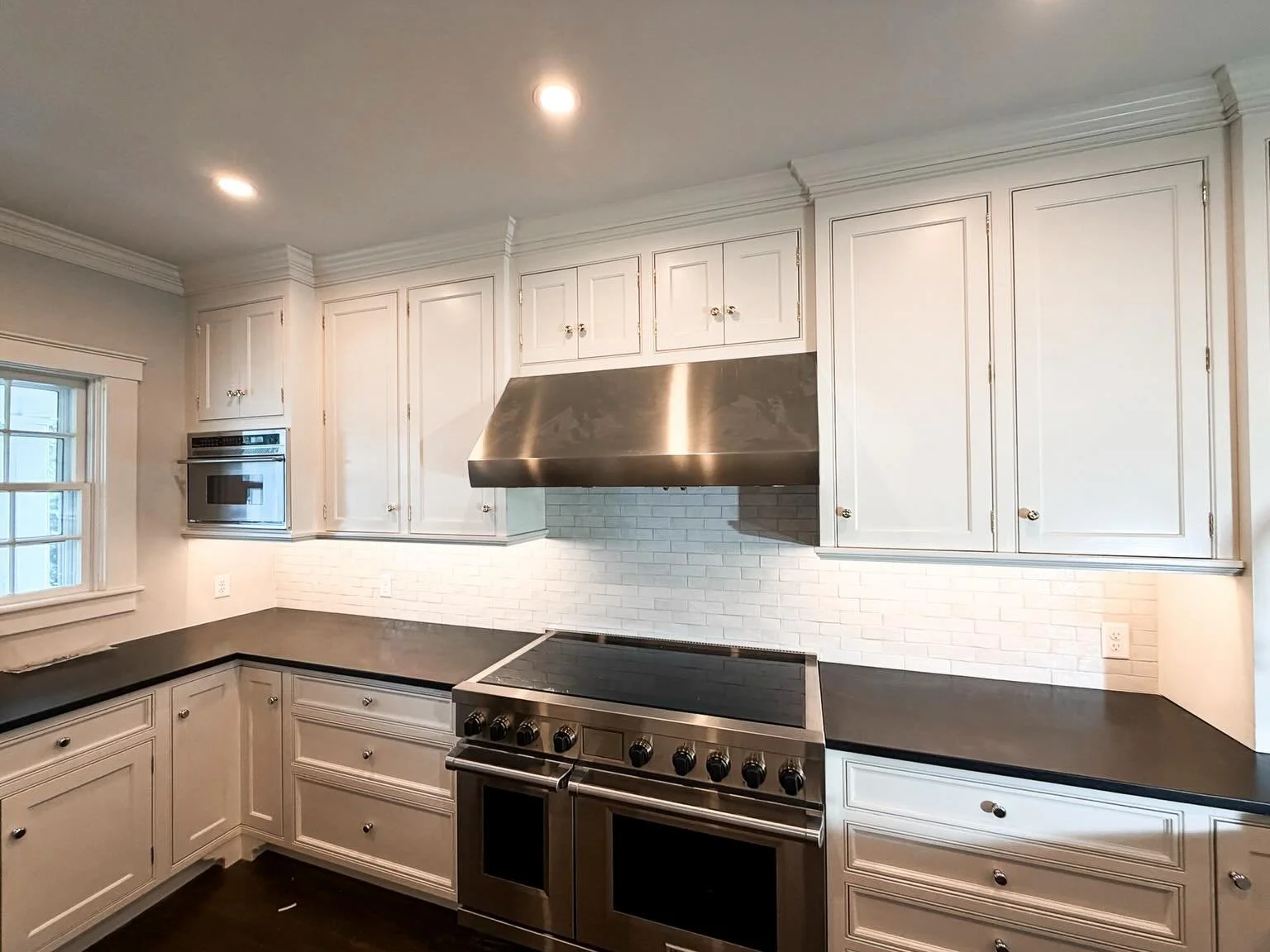 Check out the new appliances, recessed, and cabinetry lighting we installed for this kitchen remodel.
