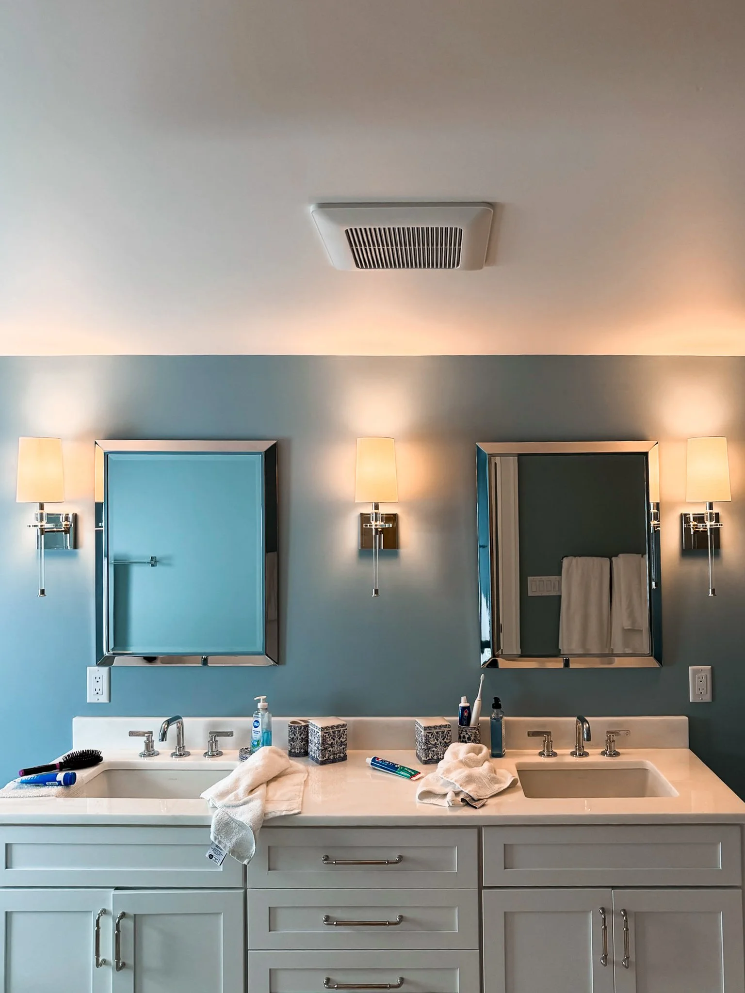 Bathroom lighting by Puopolo Electric with his and hers sinks