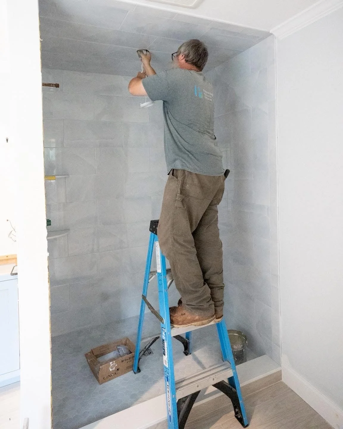 Puopolo Electric employee wiring bathroom recessed lighting in Hull, MA