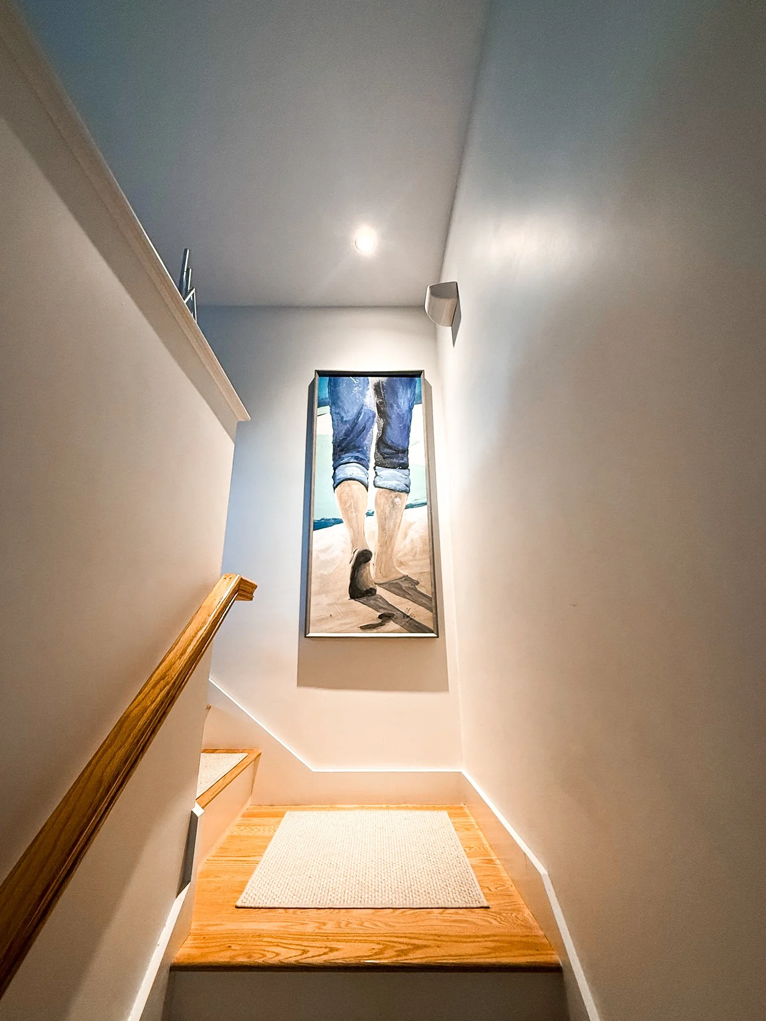LED recessed lighting for artwork on staircase