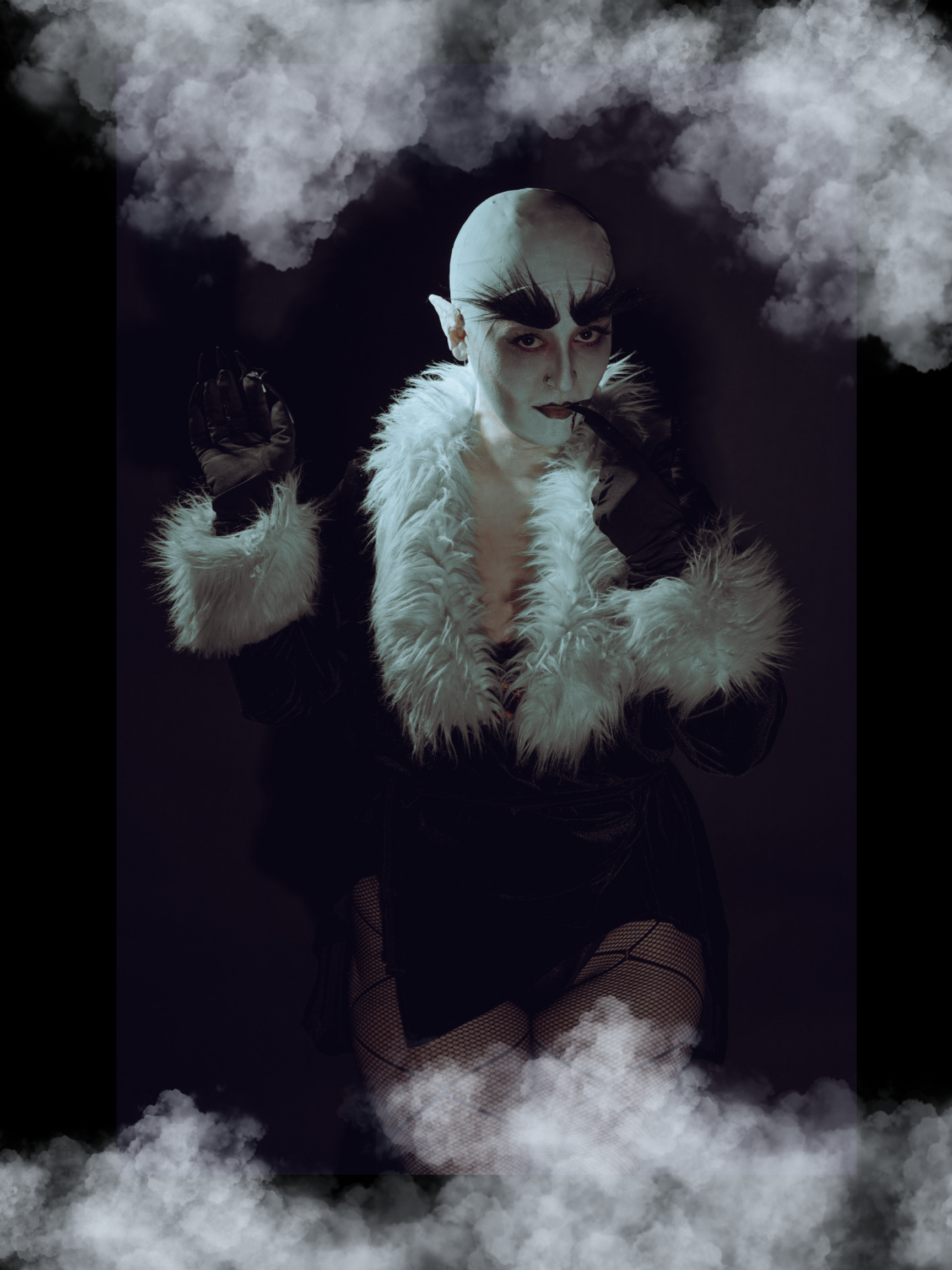 Nosferatu posing with arms towards camera, surrounded by fog