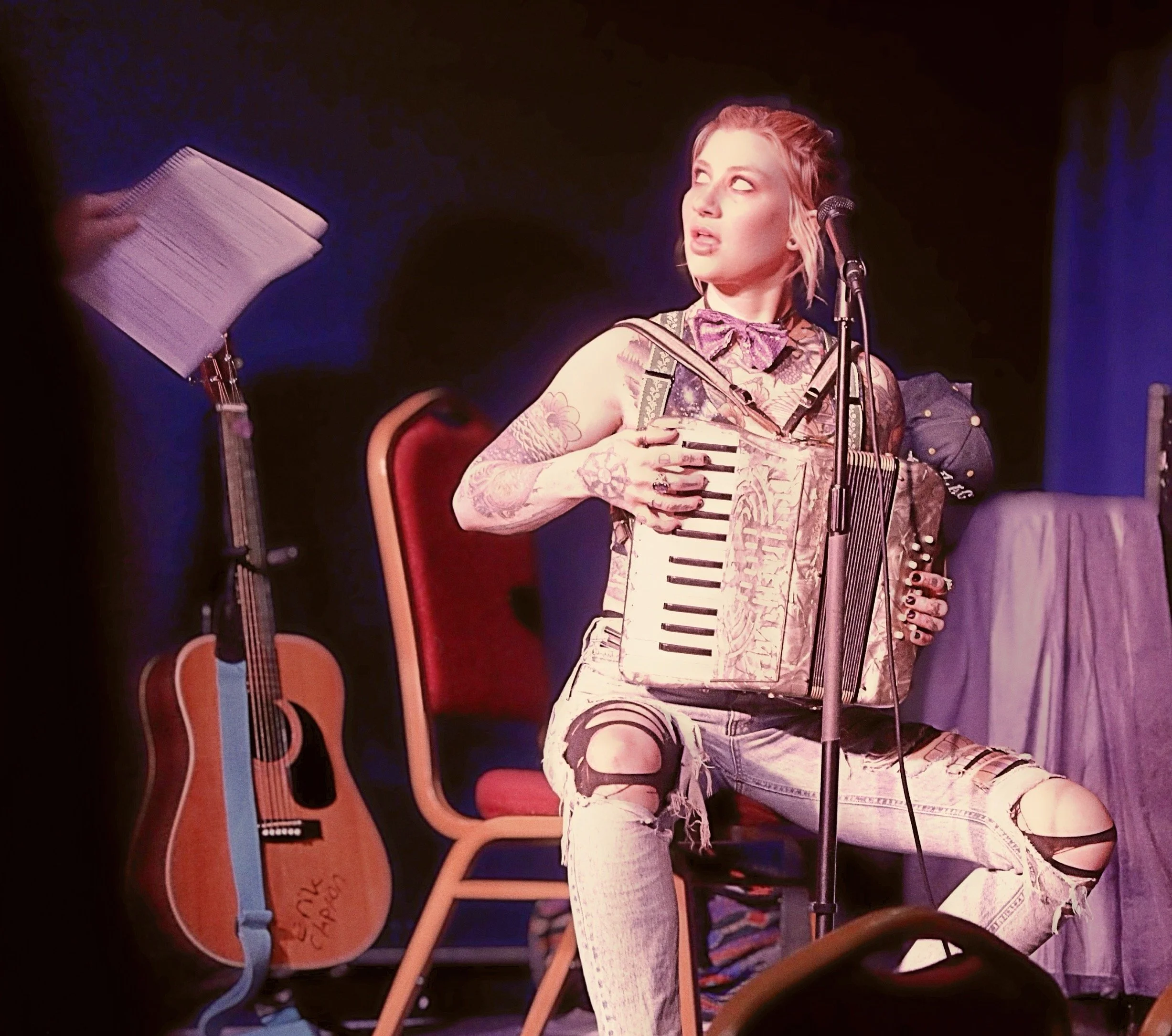 Zigzag with accordion, seated on stage