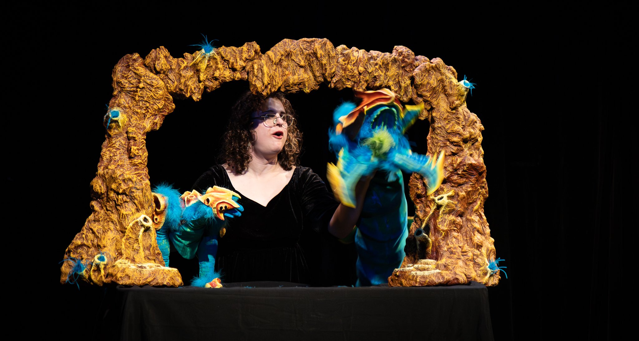 Robin Amico debuts a short “test of concept” at the Fussy Cloud Puppet Slam, puppeteering our hero alien and a giant apex alien! Photo by Brianna Jones