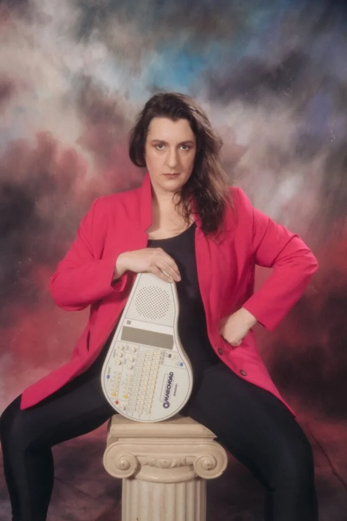 Emily Newton poses with an Omnichord. Photo courtesy of Emily Newton