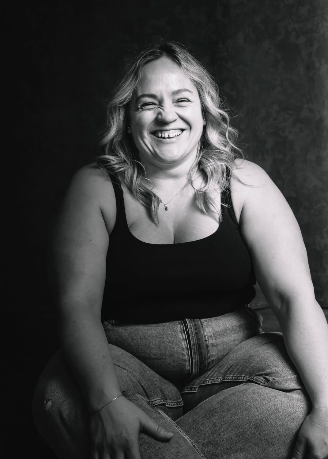 fun woman laughing in black and white photograph