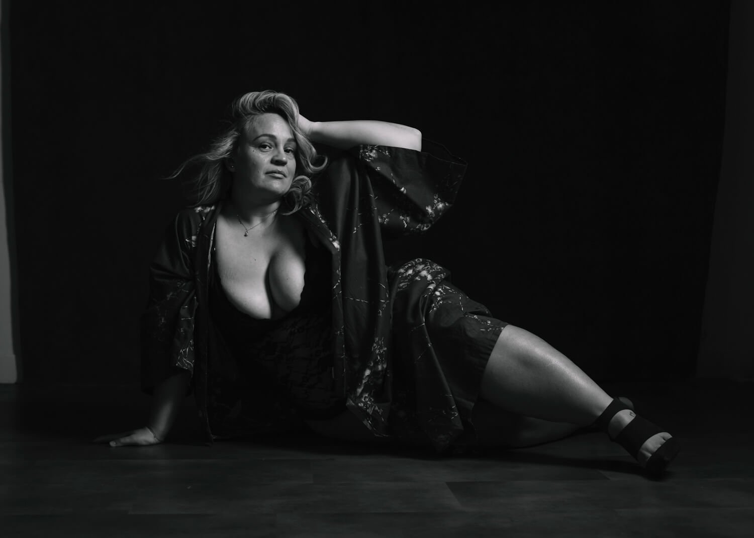 beautiful curvy woman in kimono and lingerie in shadowy black and white image