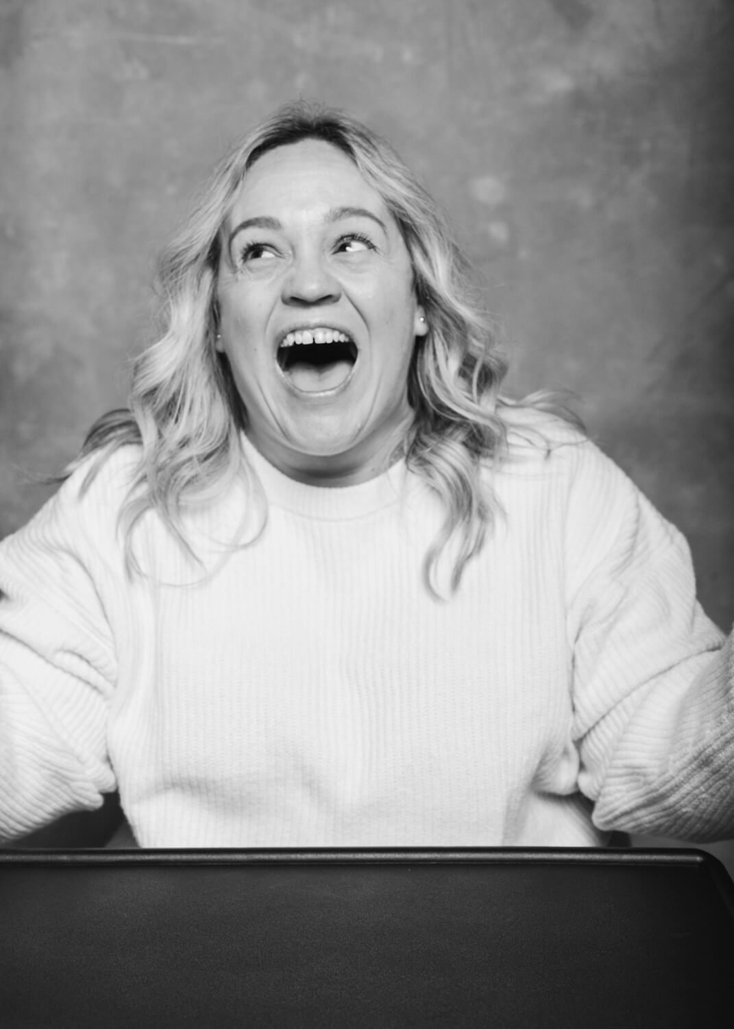 woman laughing and looking away in portrait