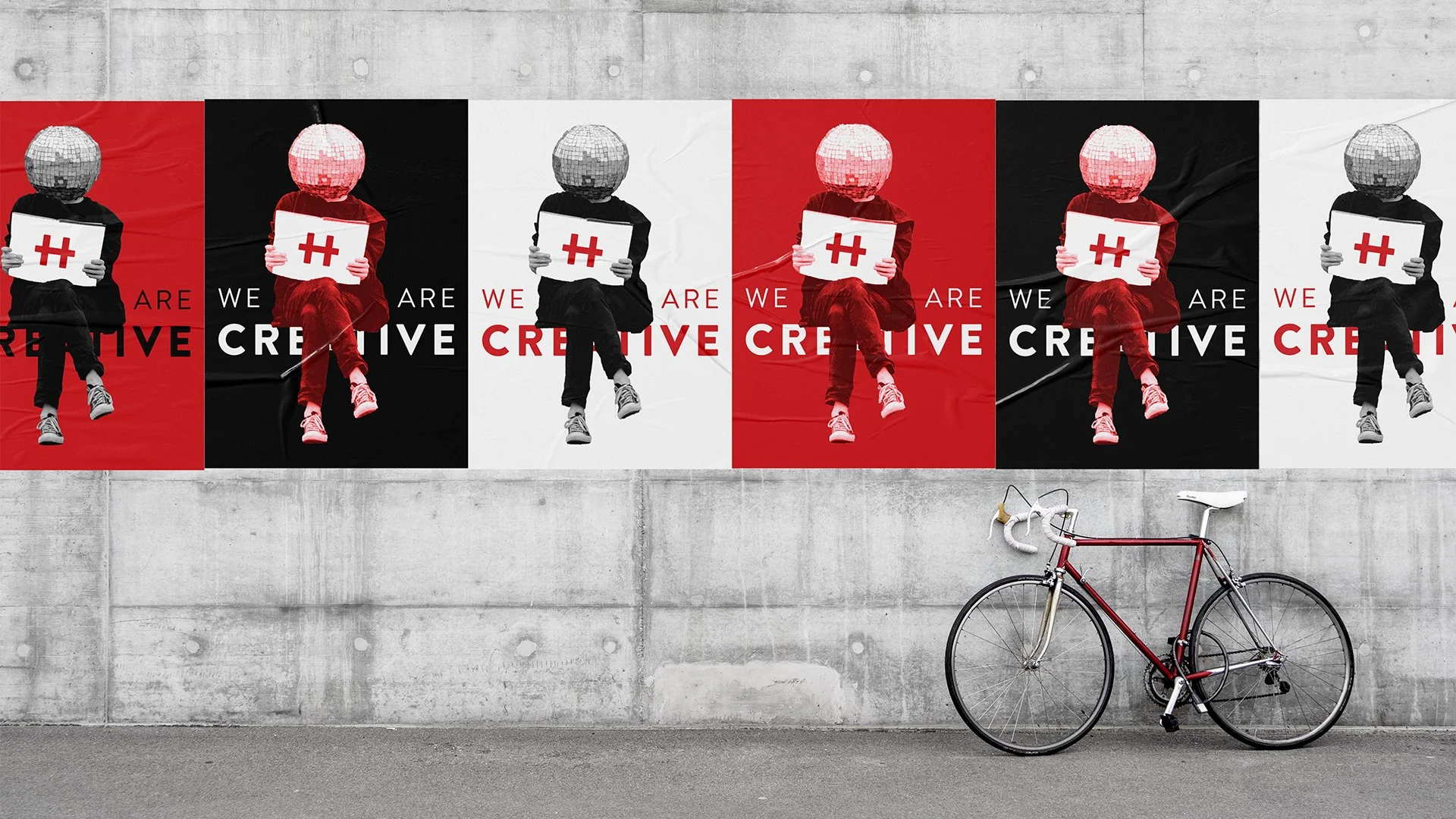 Hunter Communications "We Are Creative" Posters Pasted on Street Wall