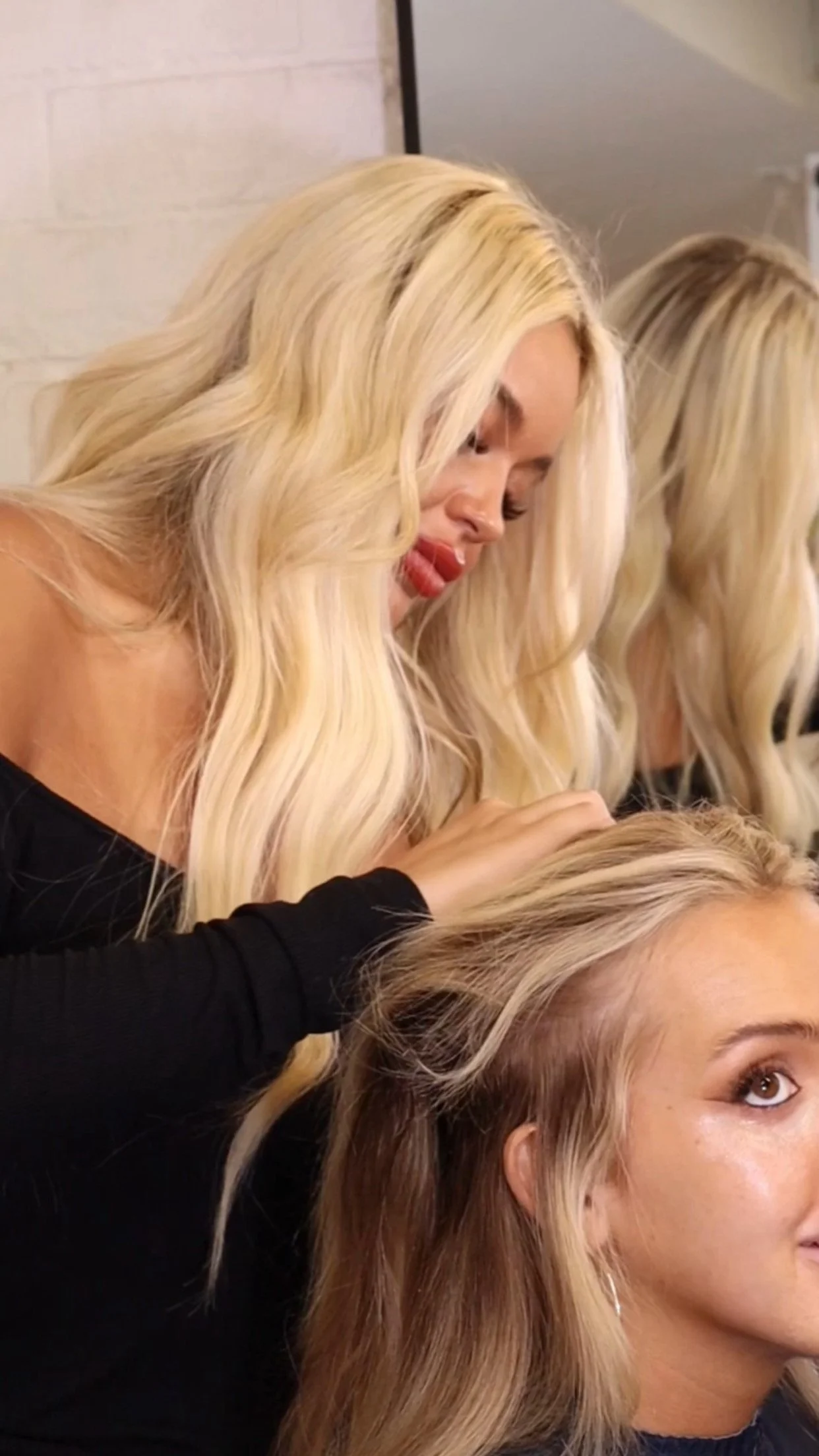 Blonde woman doing hair