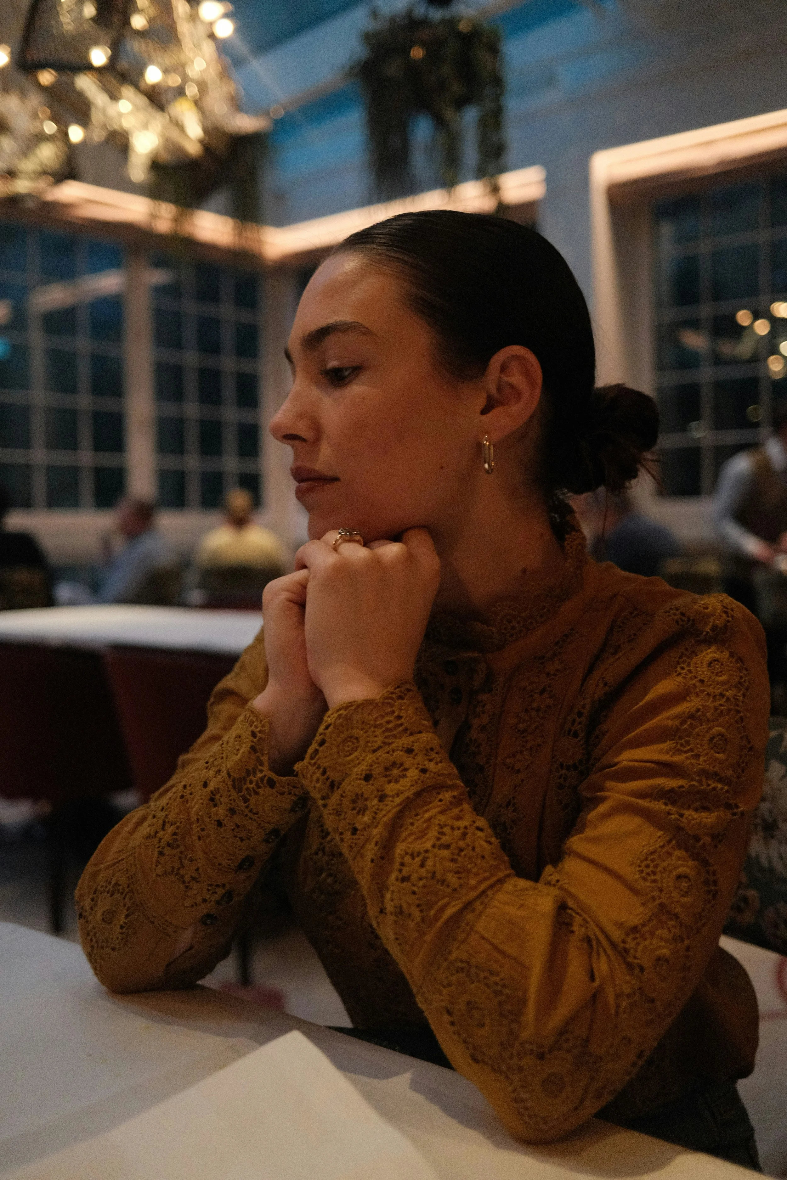 Person pausing quietly, representing the experience of anxiety and the path toward therapy in North Carolina