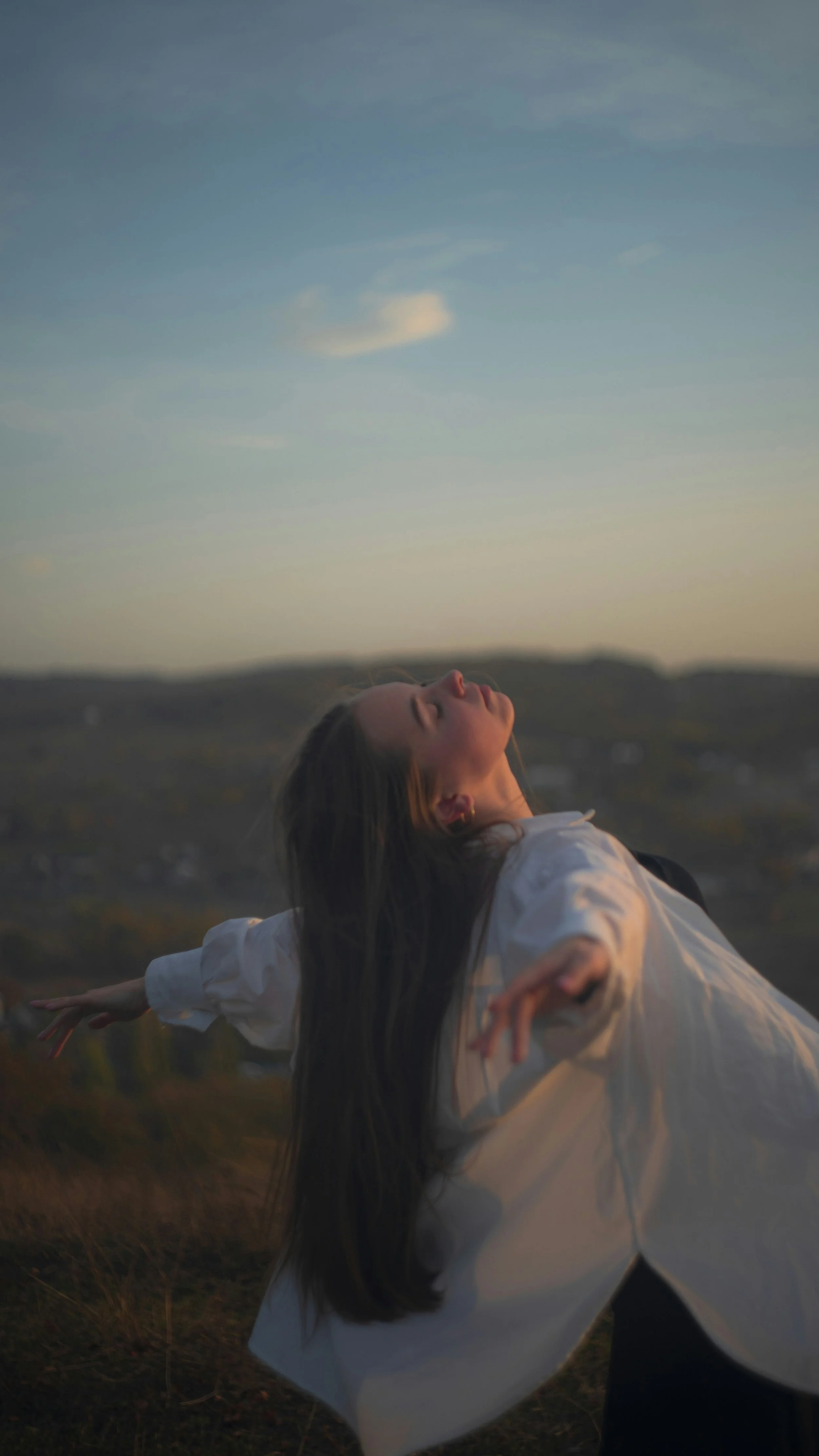 Person breathing easily outdoors, representing relief and calm as an outcome of anxiety therapy at Carolina Trauma Recovery in North Carolina