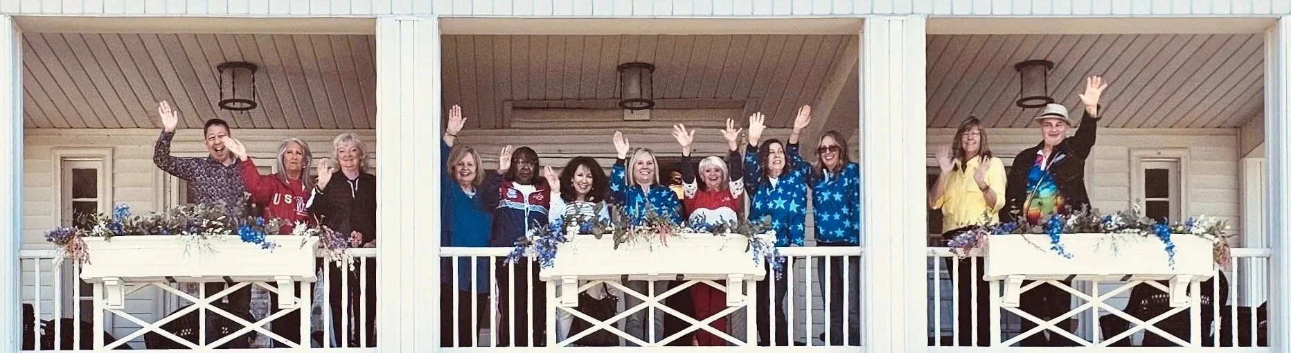 Former USCA staff, coaches, and athletes on the iconic Waldenwoods balcony