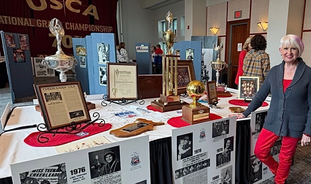 Shelia Brownlee of Lakeview High School standing with the program's historic display.