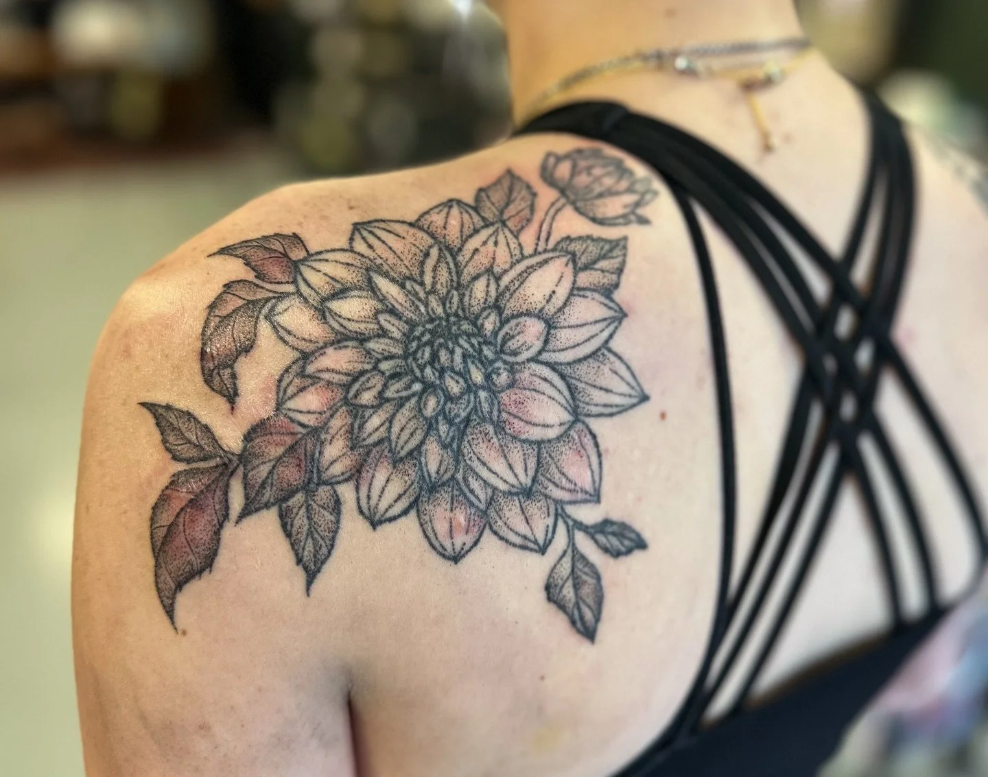 These dahlias were designed and tattooed by Katie for Stormie as part of a scar cover up. The lines are a little over a year fully healed but the shading was done more recently.

Shoot us a DM if you would to get started booking a floral tattoo with 