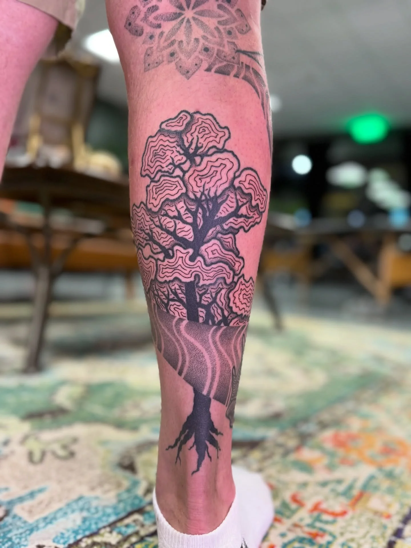 An abstract tree and wind waves for Kalan, designed and tattooed by Marki. 

This type of work by Marki is usually almost completely freehanded on her clients&rsquo; bodies, and is completely unique to that individual client. Marki and Kalan have bee