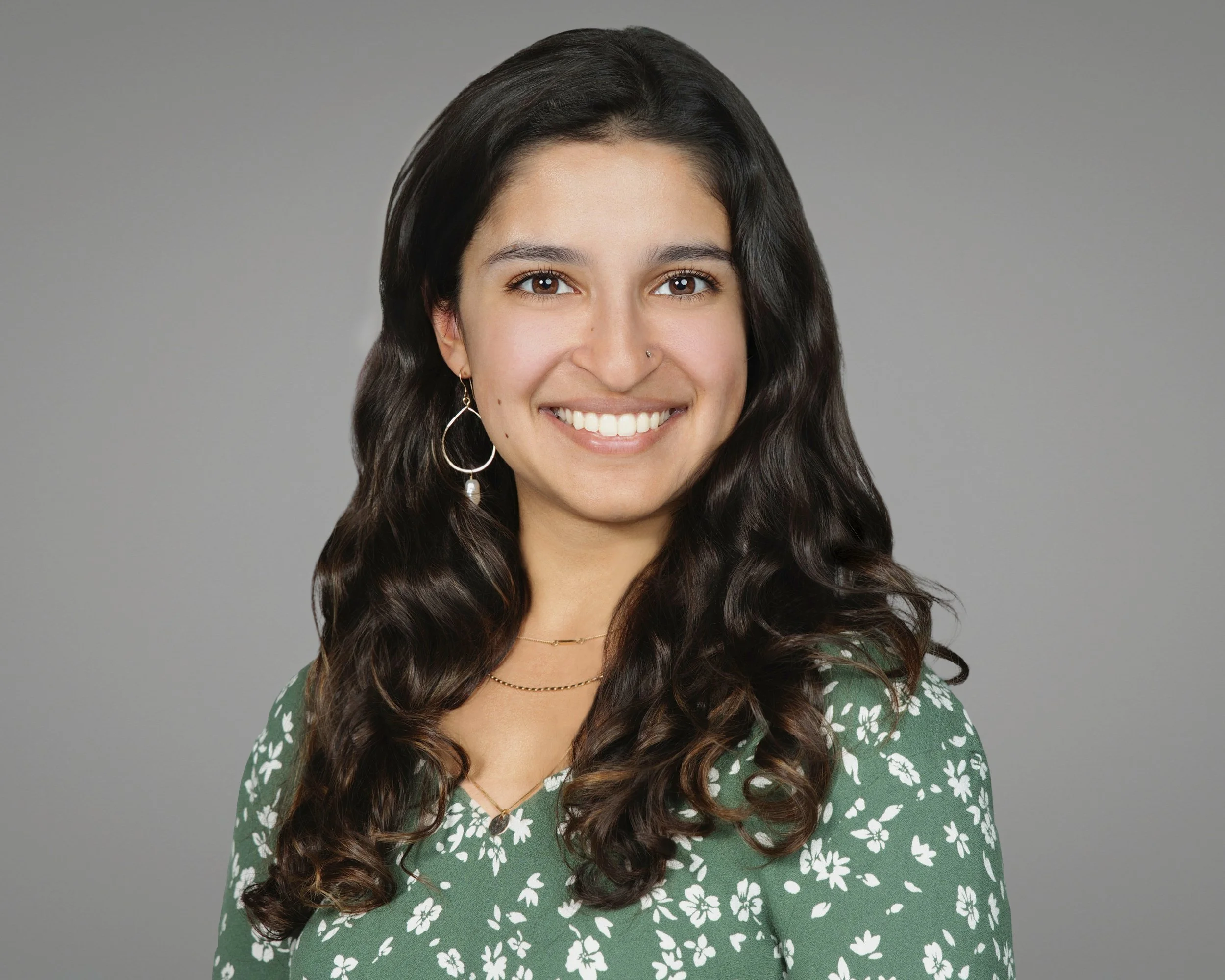 Professional headshot of a medical student in studio for resume, applications, and professional networking.