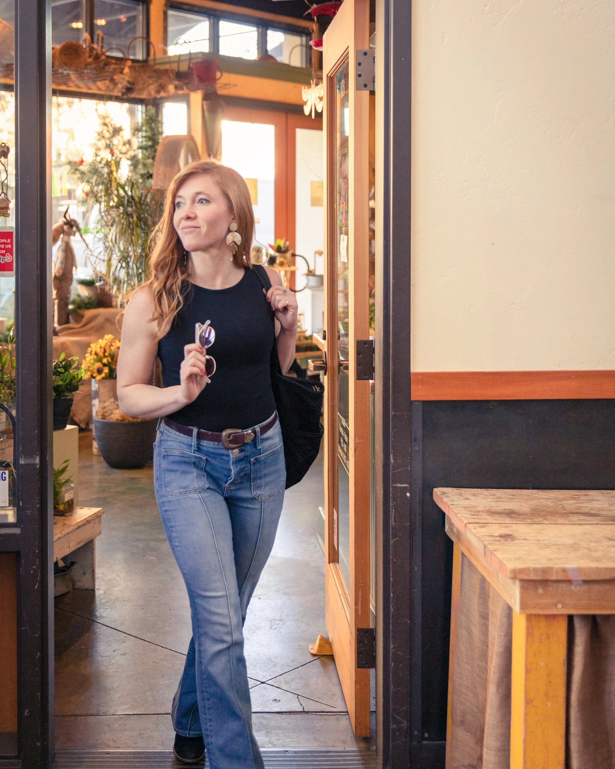 Creative solopreneur and brand designer entering studio space reflecting bold and soulful business identity