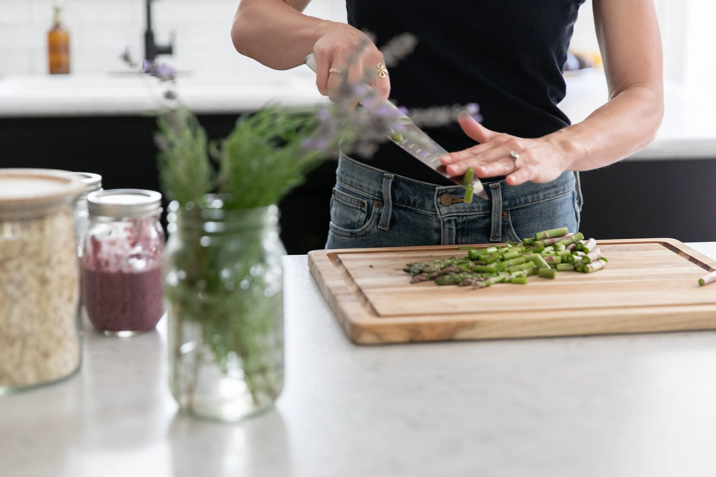 Female business owner preparing fresh vegetables in kitchen for nutrition and lifestyle branding photography
