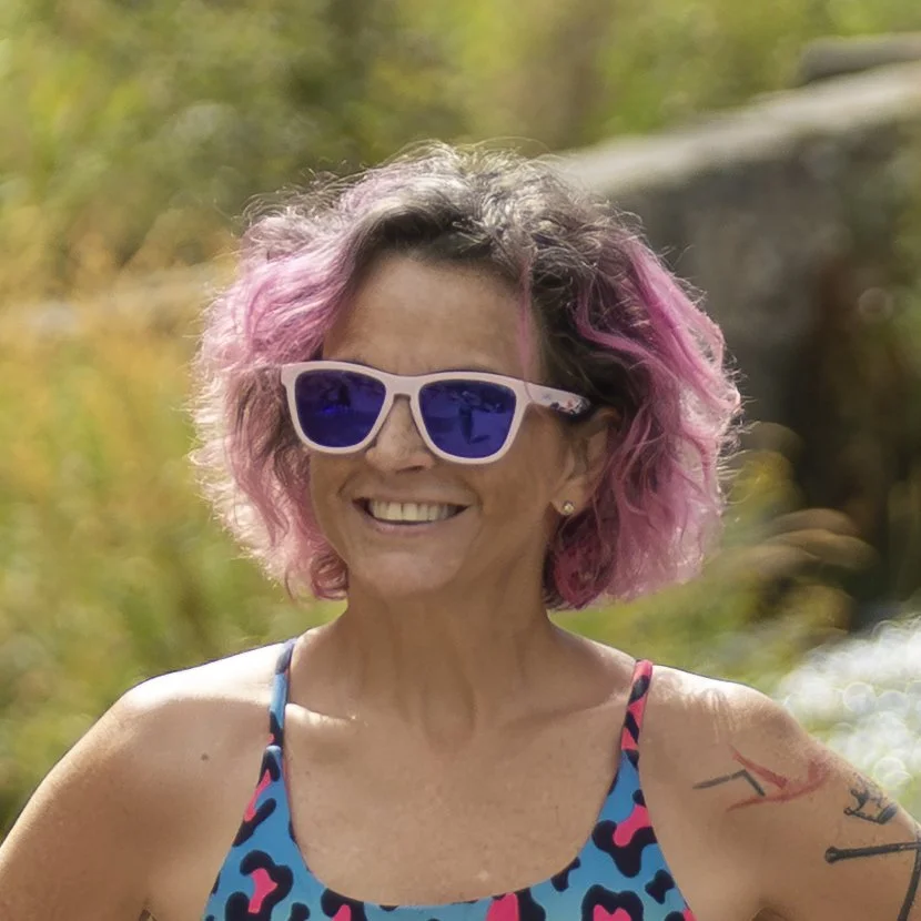 Confident personal coach with vibrant style representing bold self-expression and empowered living brand