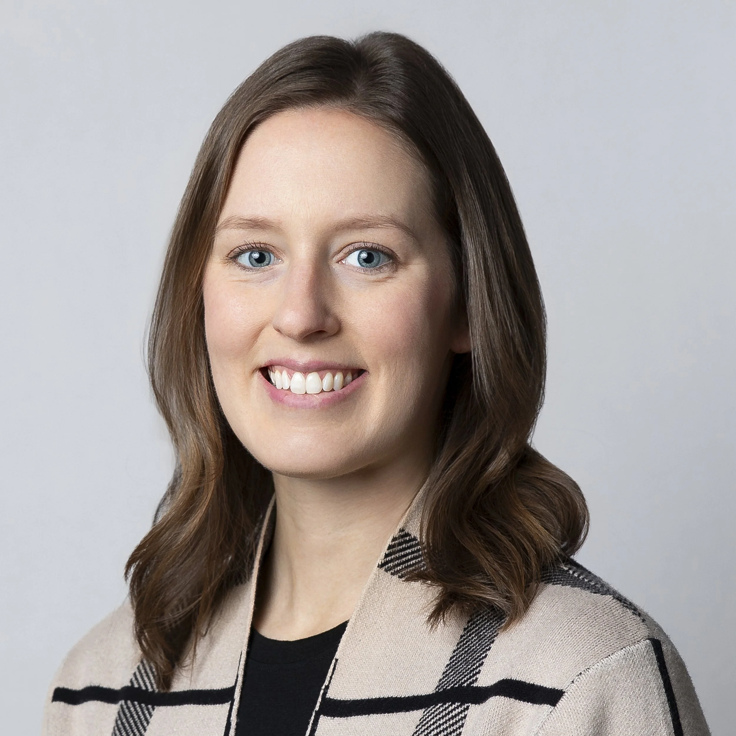 Professional dentist headshot of female dental provider for website and patient marketing
