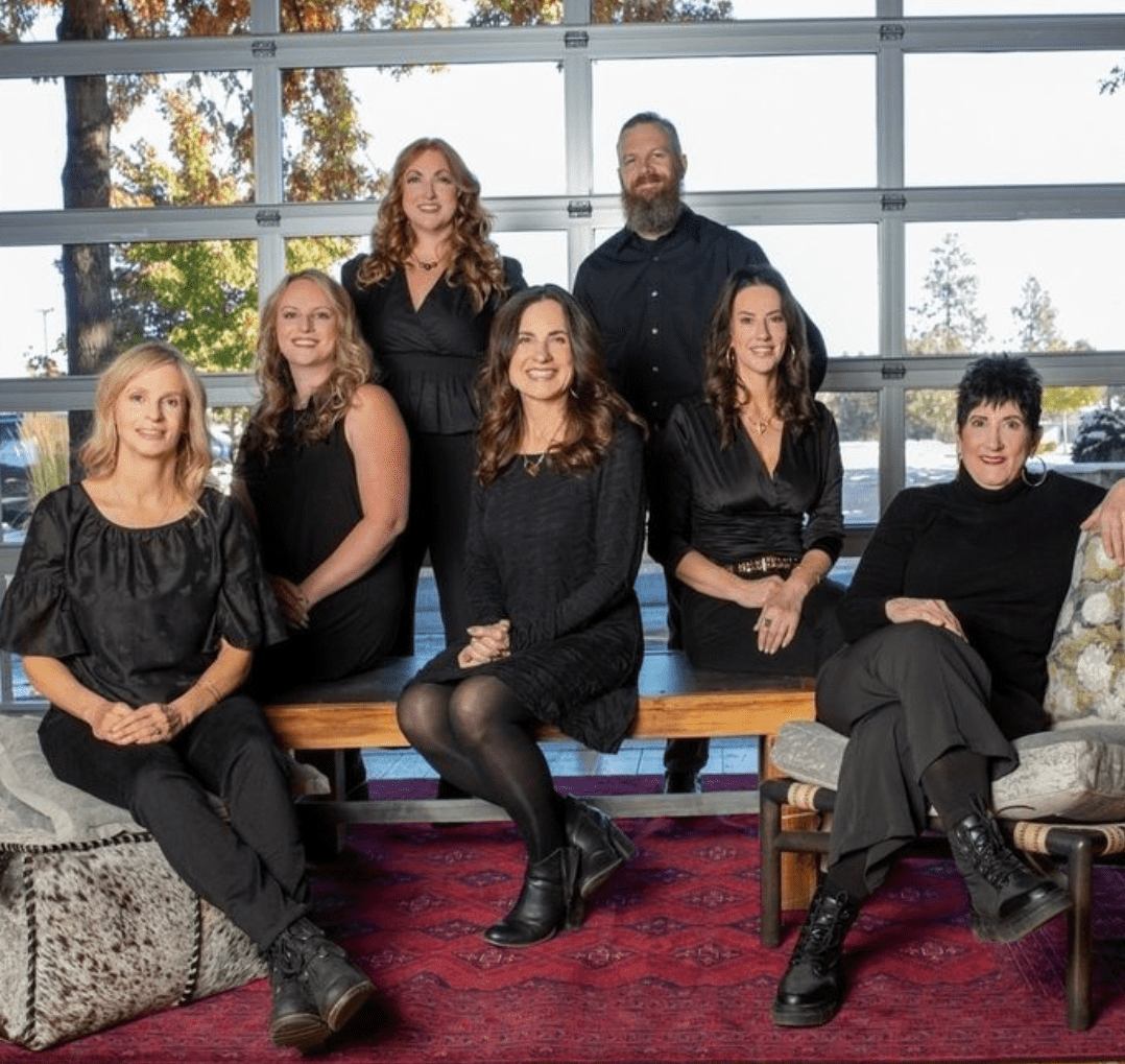 Team branding photo of business professionals in Bend Oregon with warm natural light and modern interior