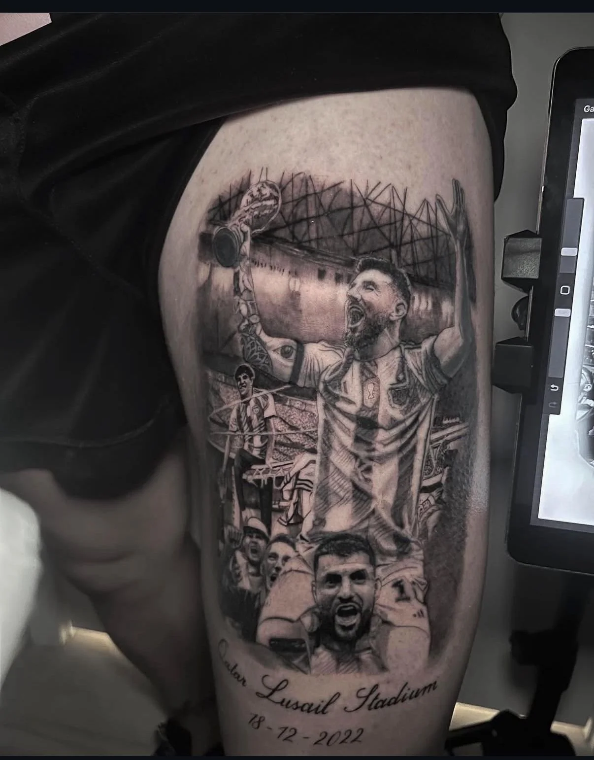 Black and grey realism tattoo of Lionel Messi celebrating in a stadium, detailed sports portrait tattoo by a Miami Beach tattoo shop