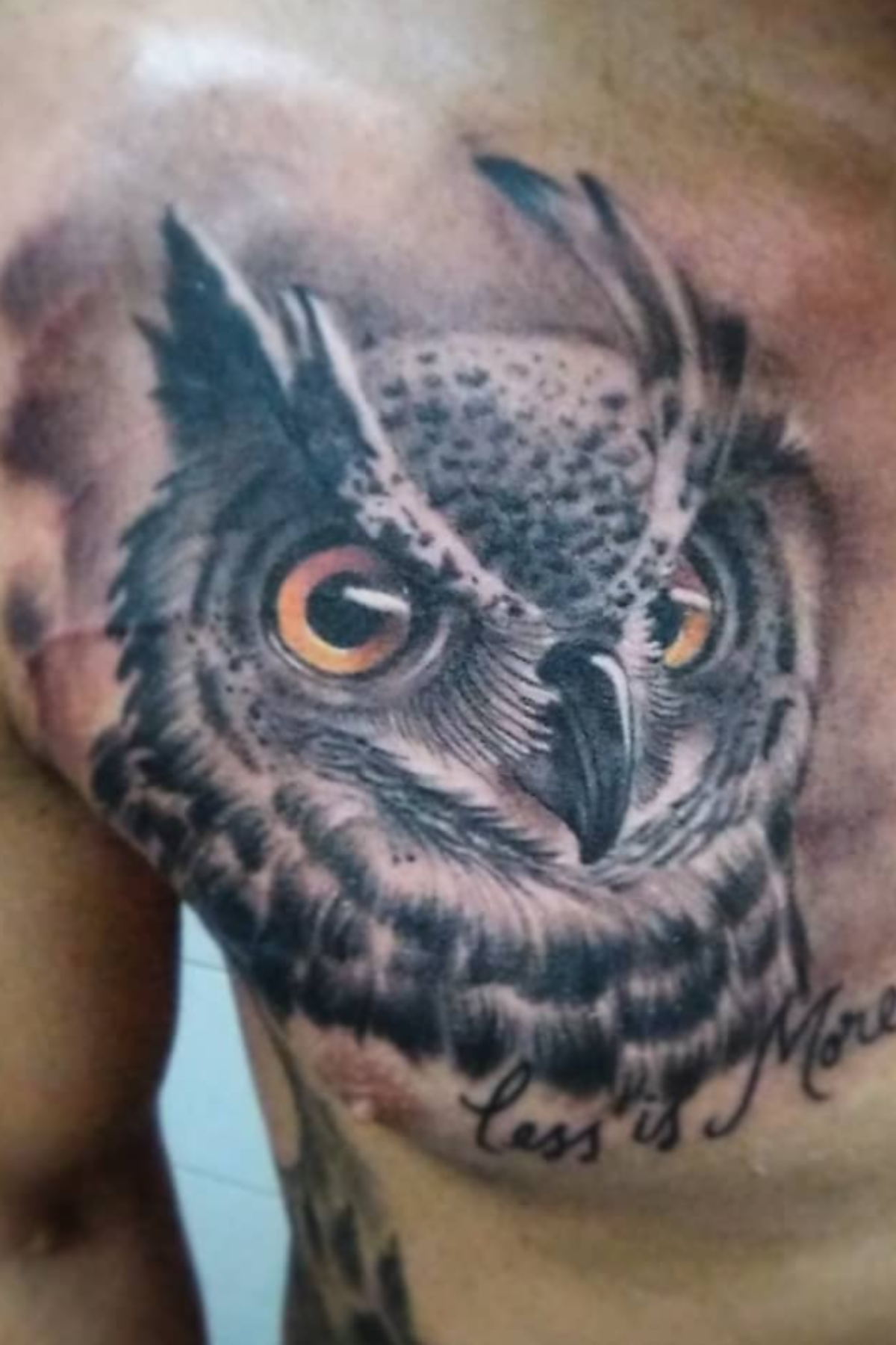 Large owl chest tattoo by Alfonso