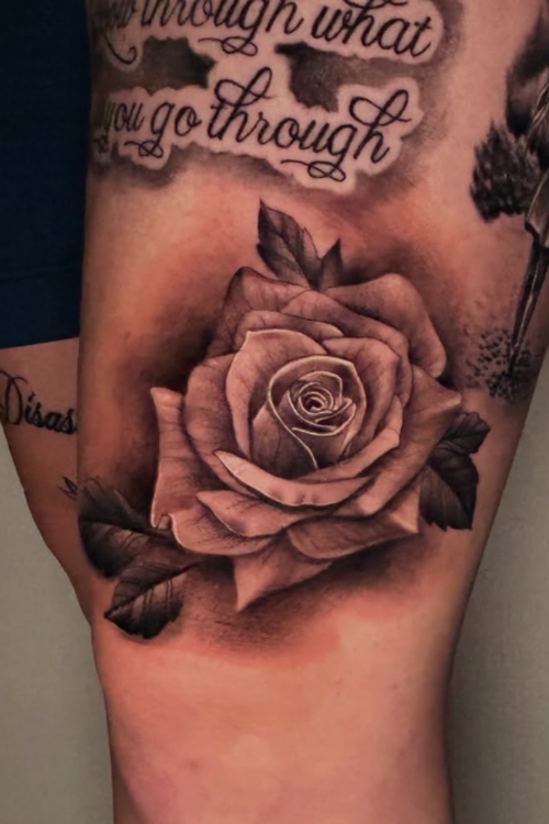 Realistic rose tattoo by Alfonso at Salvation Tattoo Lounge in Coral Springs