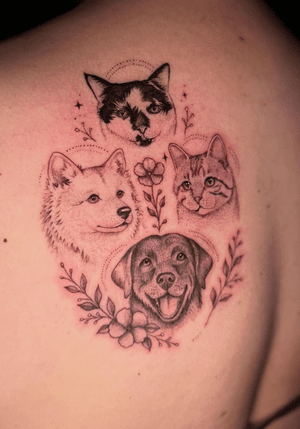 Fine-line pet portrait tattoo featuring cats and dogs with floral details by Carol