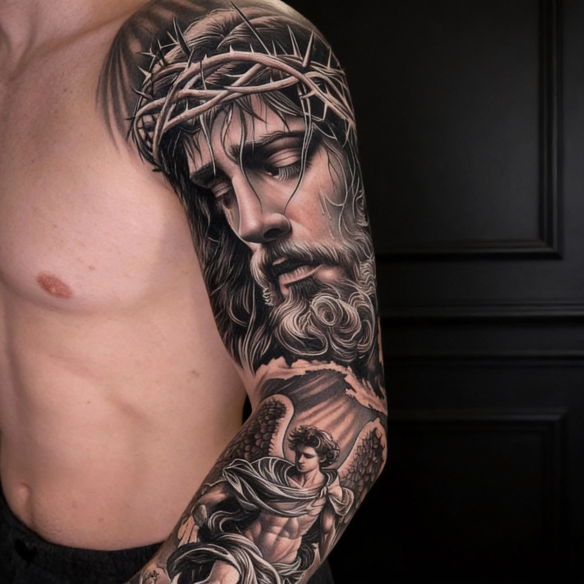 Realism tattoo sleeve in Chapel Hill NC featuring detailed black and grey portrait work