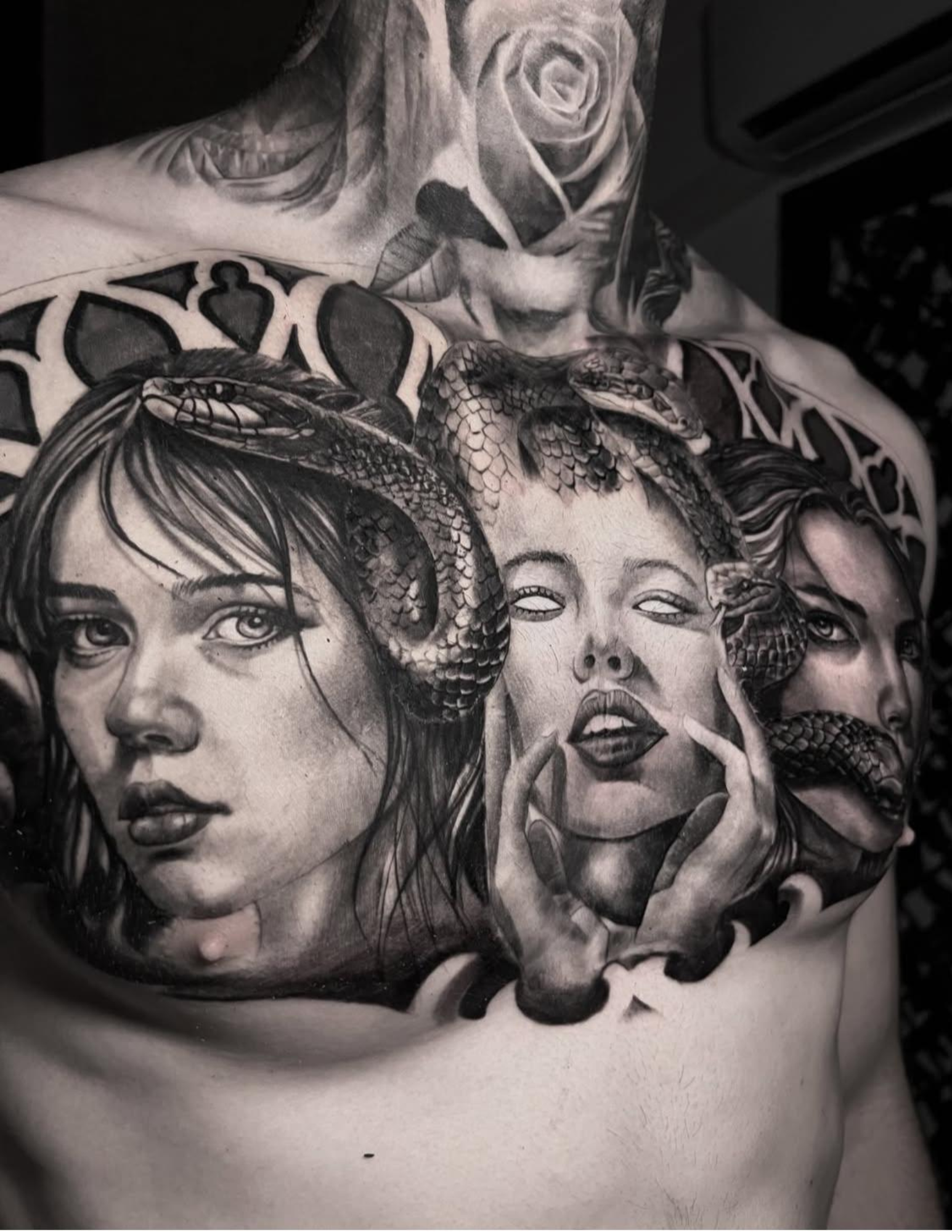 Black and gray female portrait collage chest tattoo by Macu at Salvation Tattoo Lounge Miami Beach