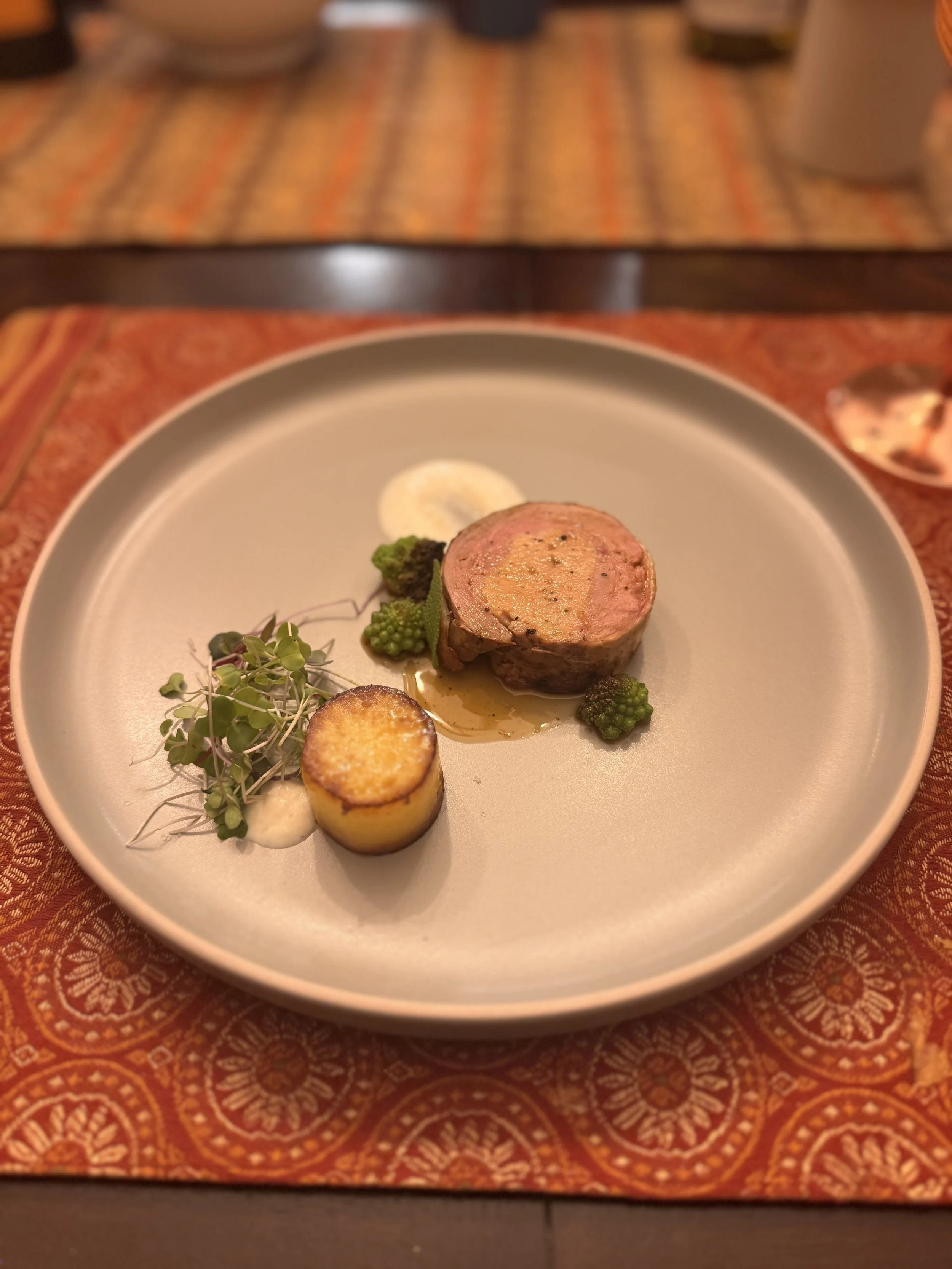 Duck Ballotine with fondant potato, celeriac macadamia puree, romanesco