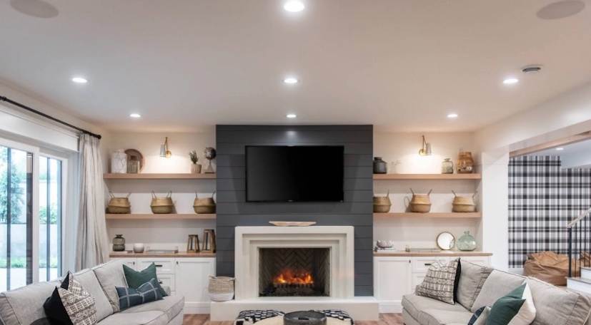 Living room with a fireplace, wall-mounted TV in Henderson Las Vegas