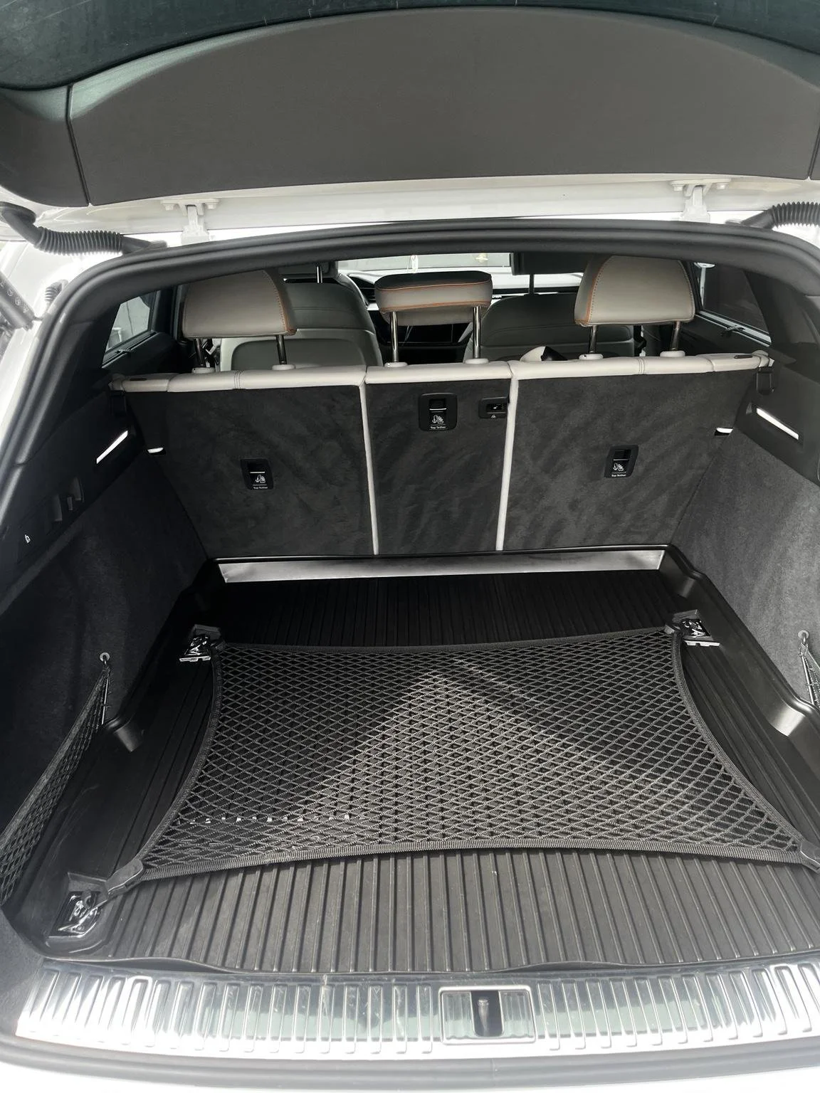 Audi e-tron rear cargo area after premium interior detailing service in Bonney Lake by Bryanz Auto Detailing featuring deep cleaning and restored trunk appearance.