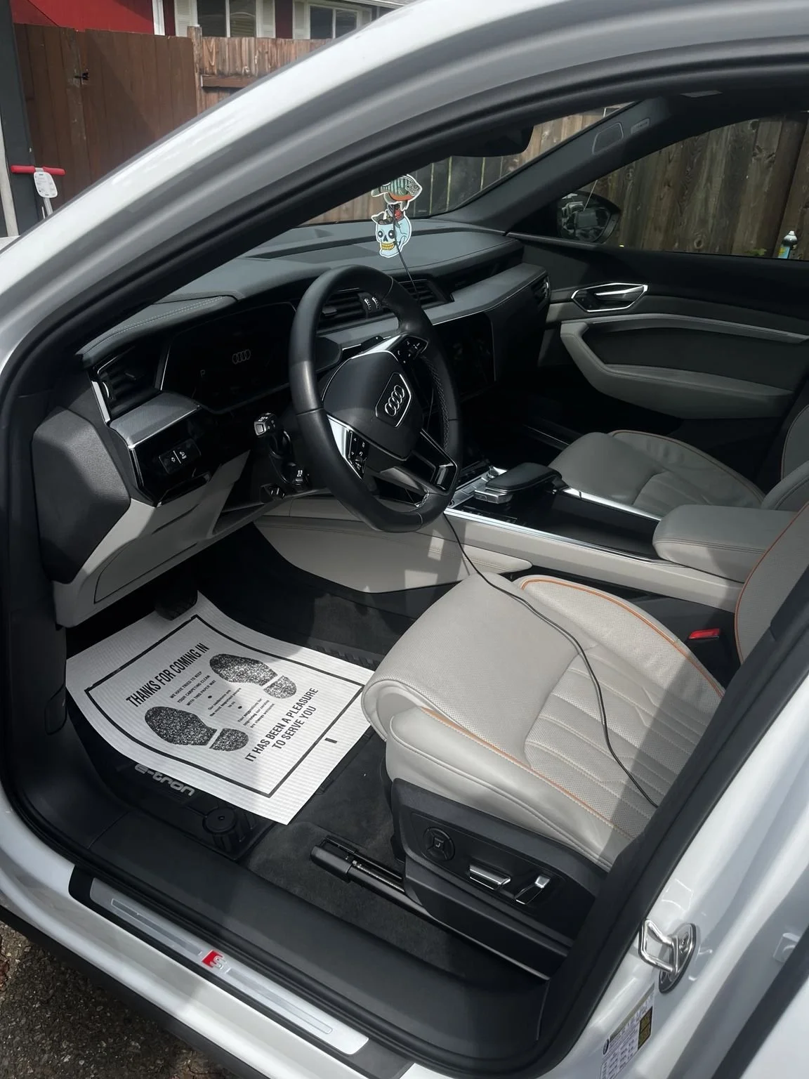 Luxury Audi e-tron interior after full mobile interior detailing in Bonney Lake WA featuring deep cleaning of leather seats dashboard and center console by Bryanz Auto Detailing
