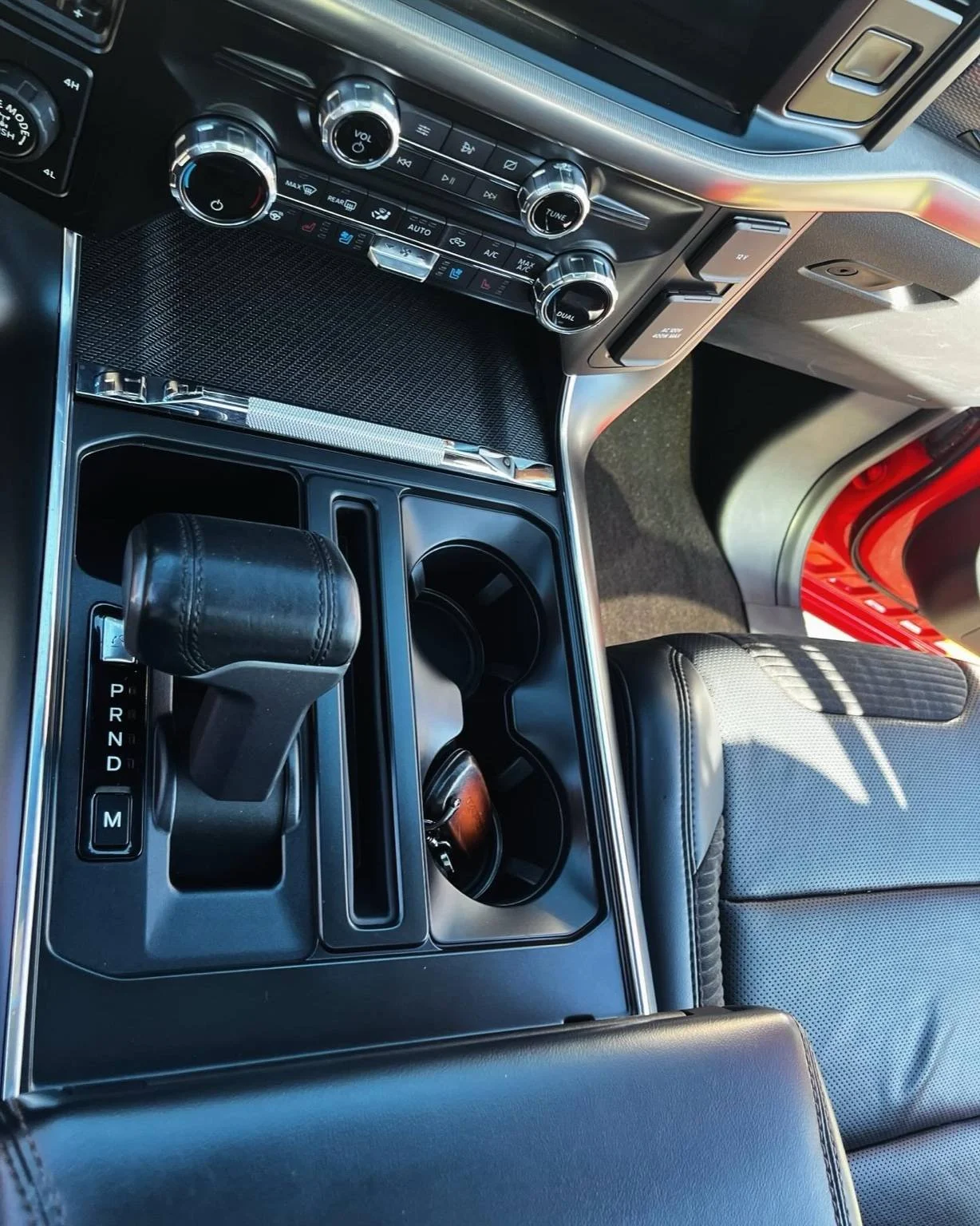 Ford Raptor center console fully detailed and restored by Bryanz Auto Detailing.