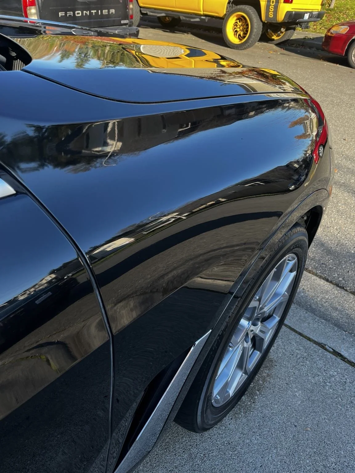 Glossy black BMW X7 paint after professional ceramic coating in Kent, WA