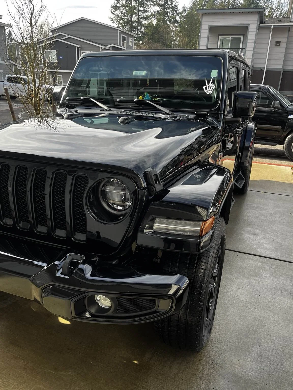 Glossy black Jeep exterior after professionals detailing by Bryanz Auto Detailing