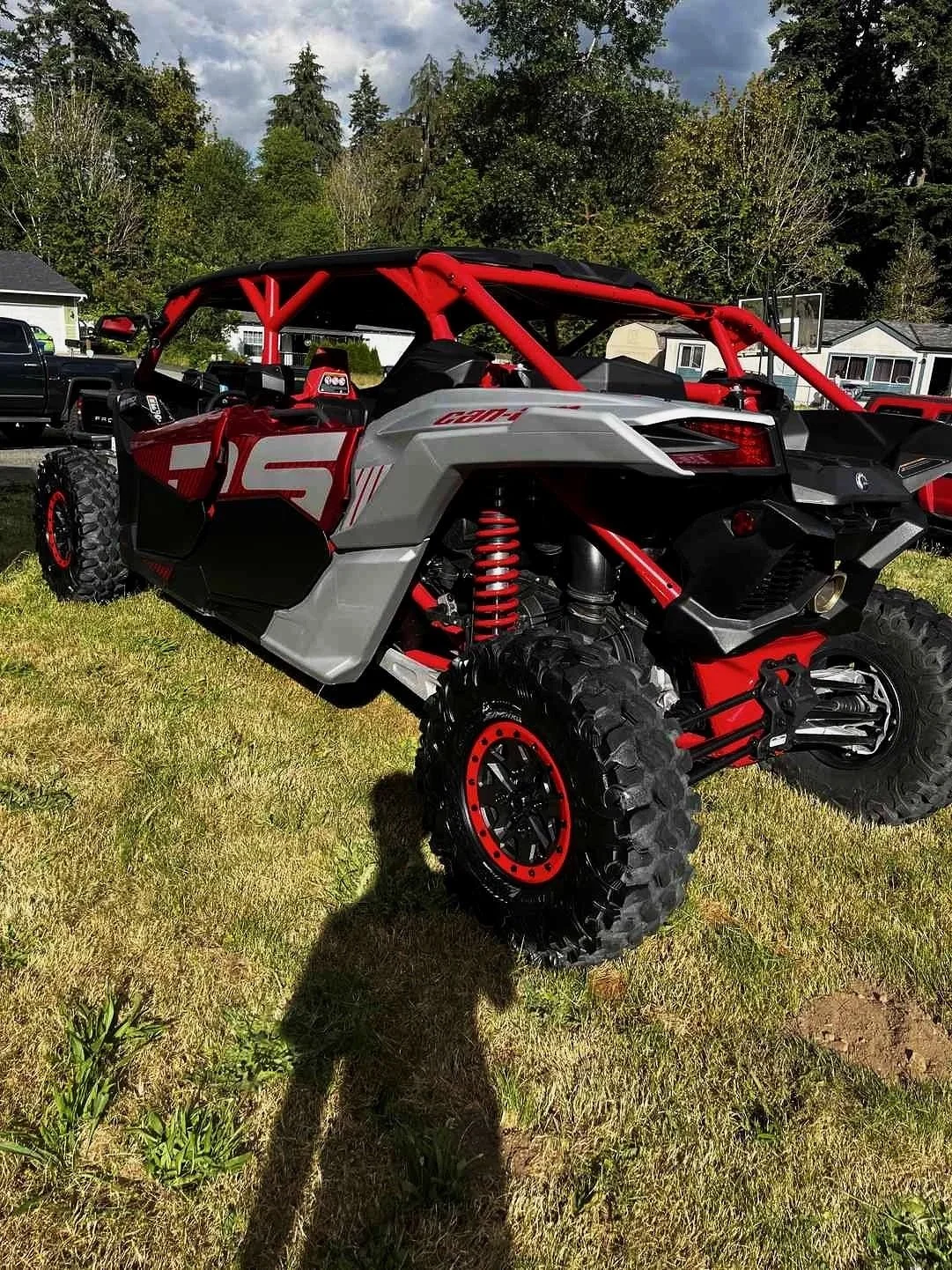Fircres Can-Am off-road vehicle detailing with glossy paint, clean suspension, and polished rims