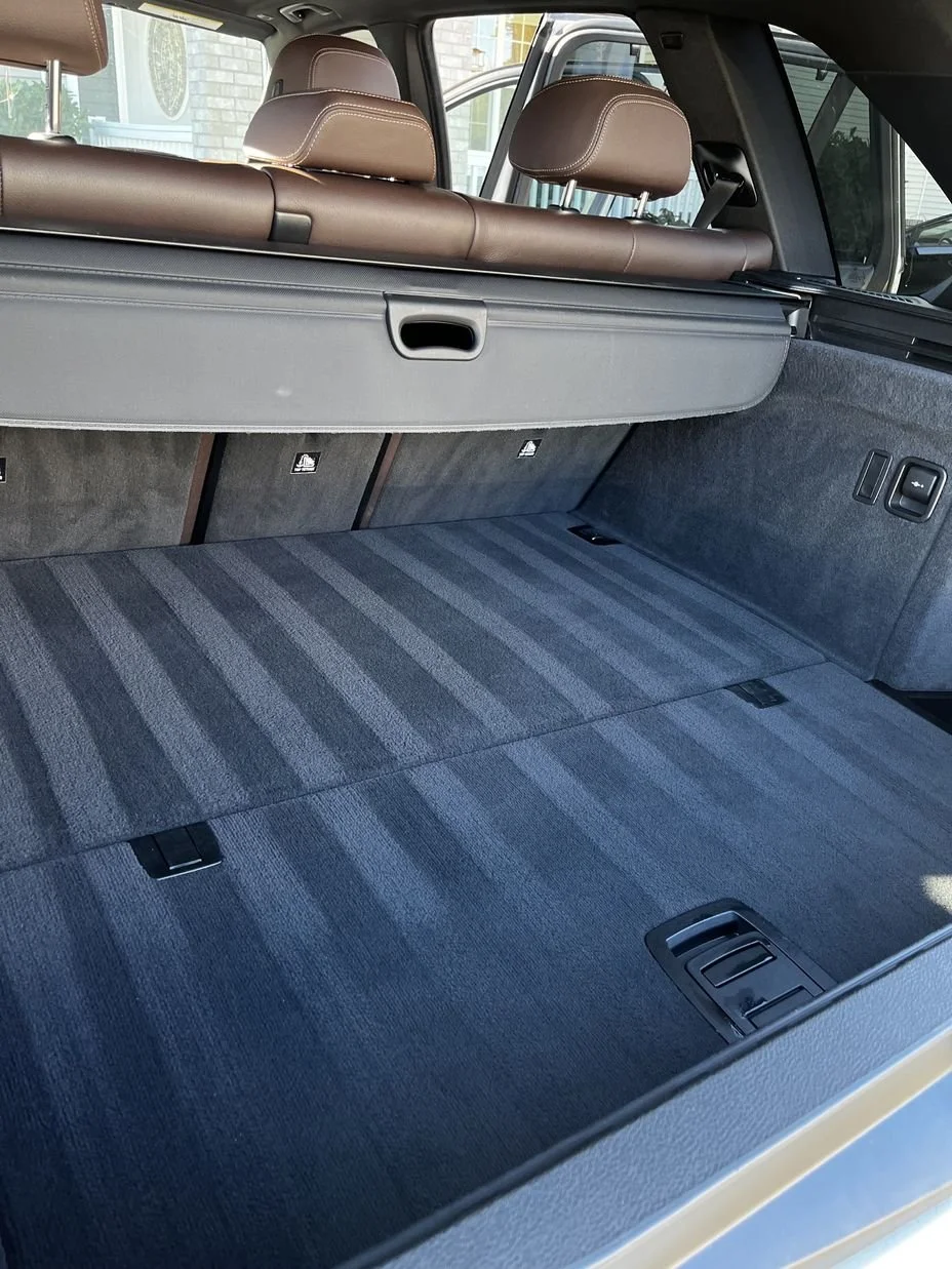 Renton Mobile auto detailing on SUV trunk with deep carpet cleaning and precise vacuum lines