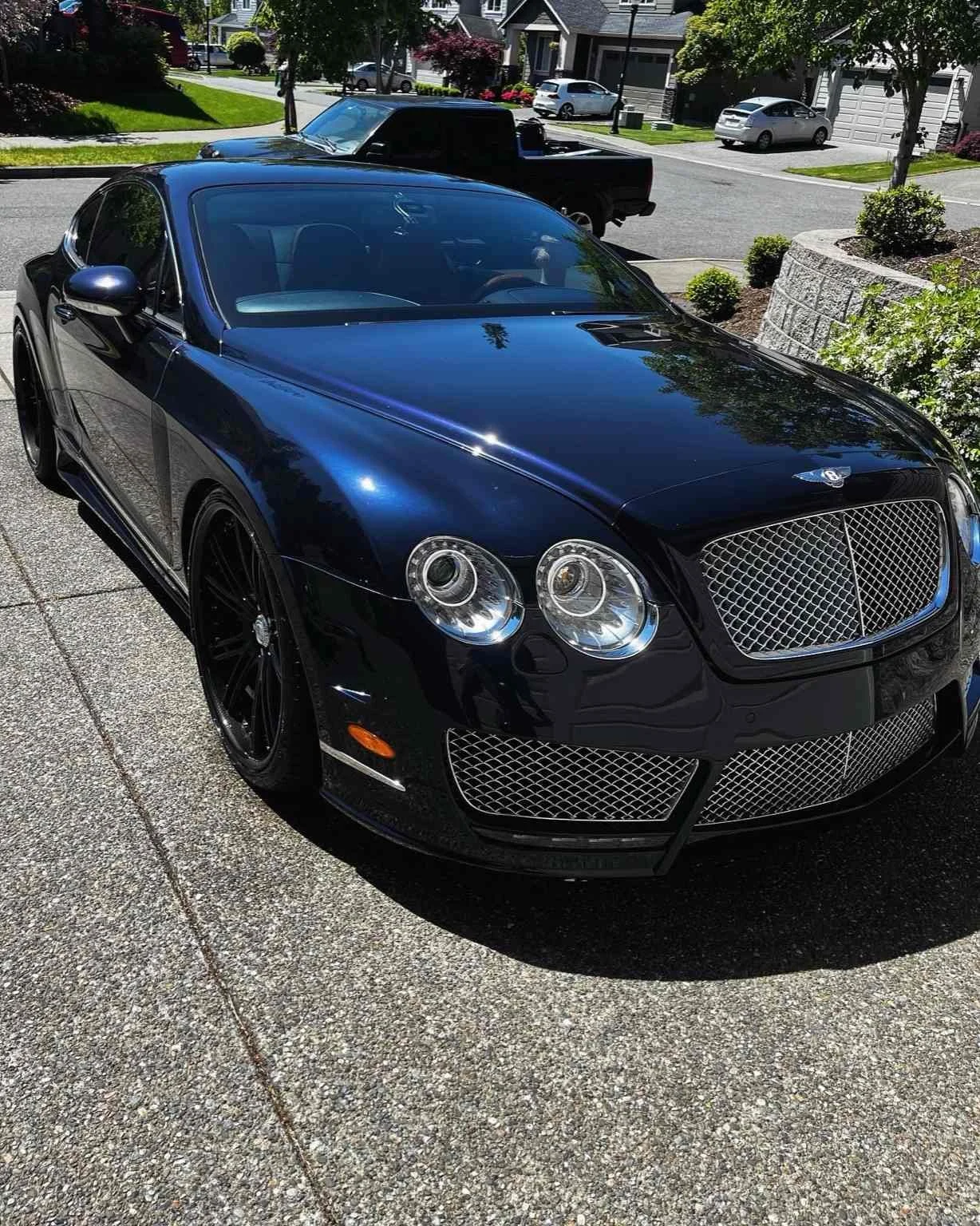 Glossy black Bentley exterior after a professional detail in Ruston, Washington by Bryanz Auto Detailing
