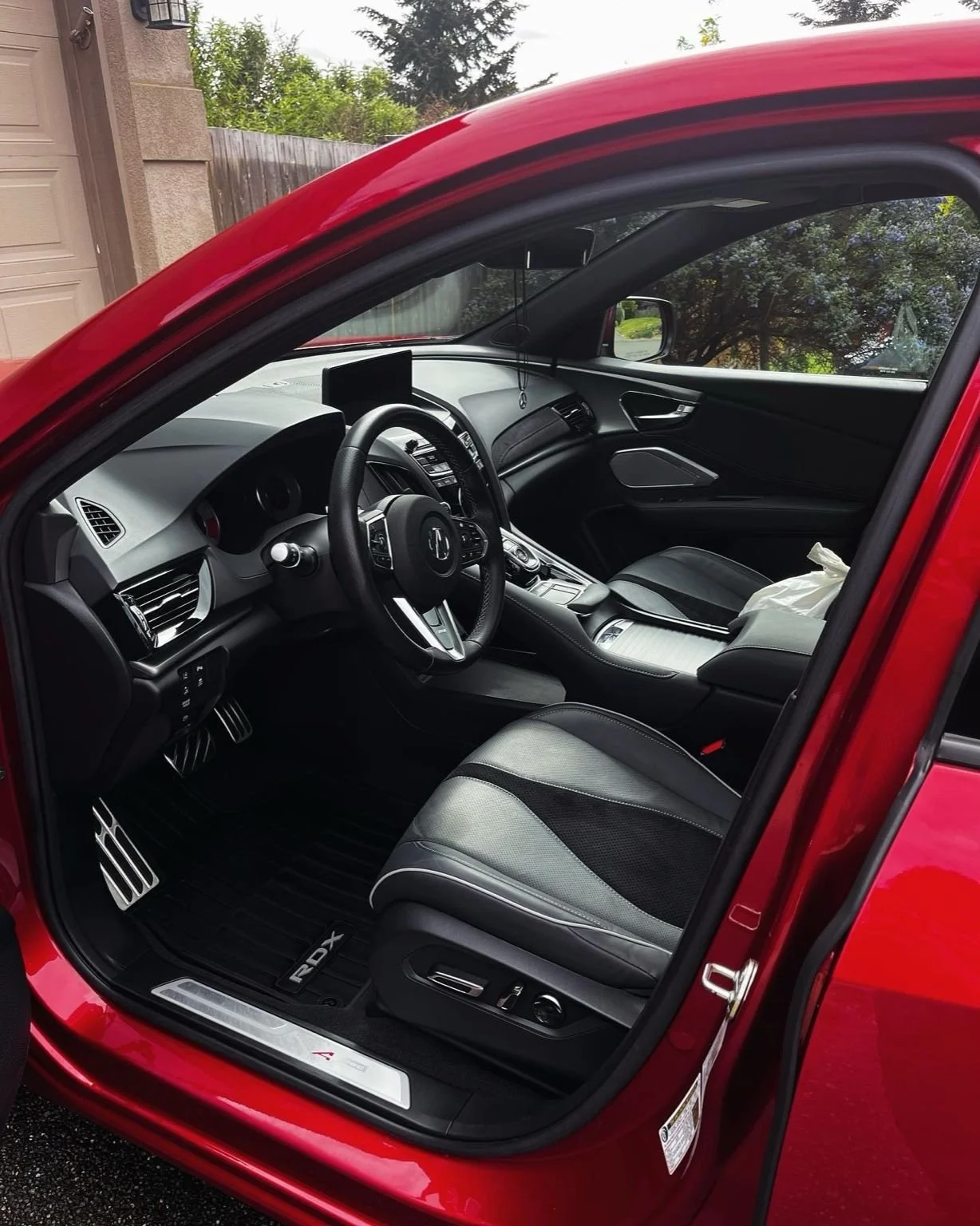 Detailed interior of a red Acura RDX with leather seats cleaned in Ruston, Washington by Bryanz Auto Detailing