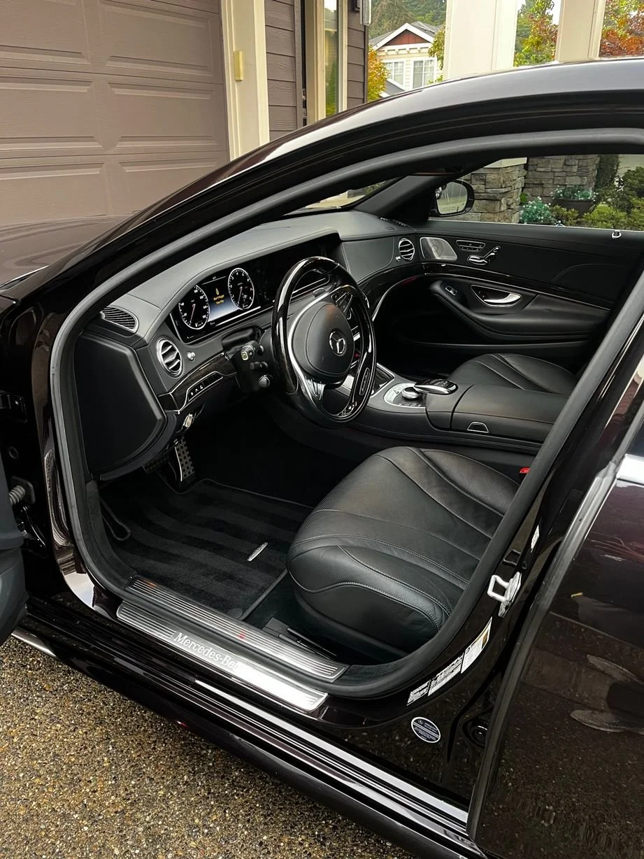 Mercedes -Benz interior detailing with deep-cleaned leather front seat, restored luxury cabin surfaces, and refreshed driver area.