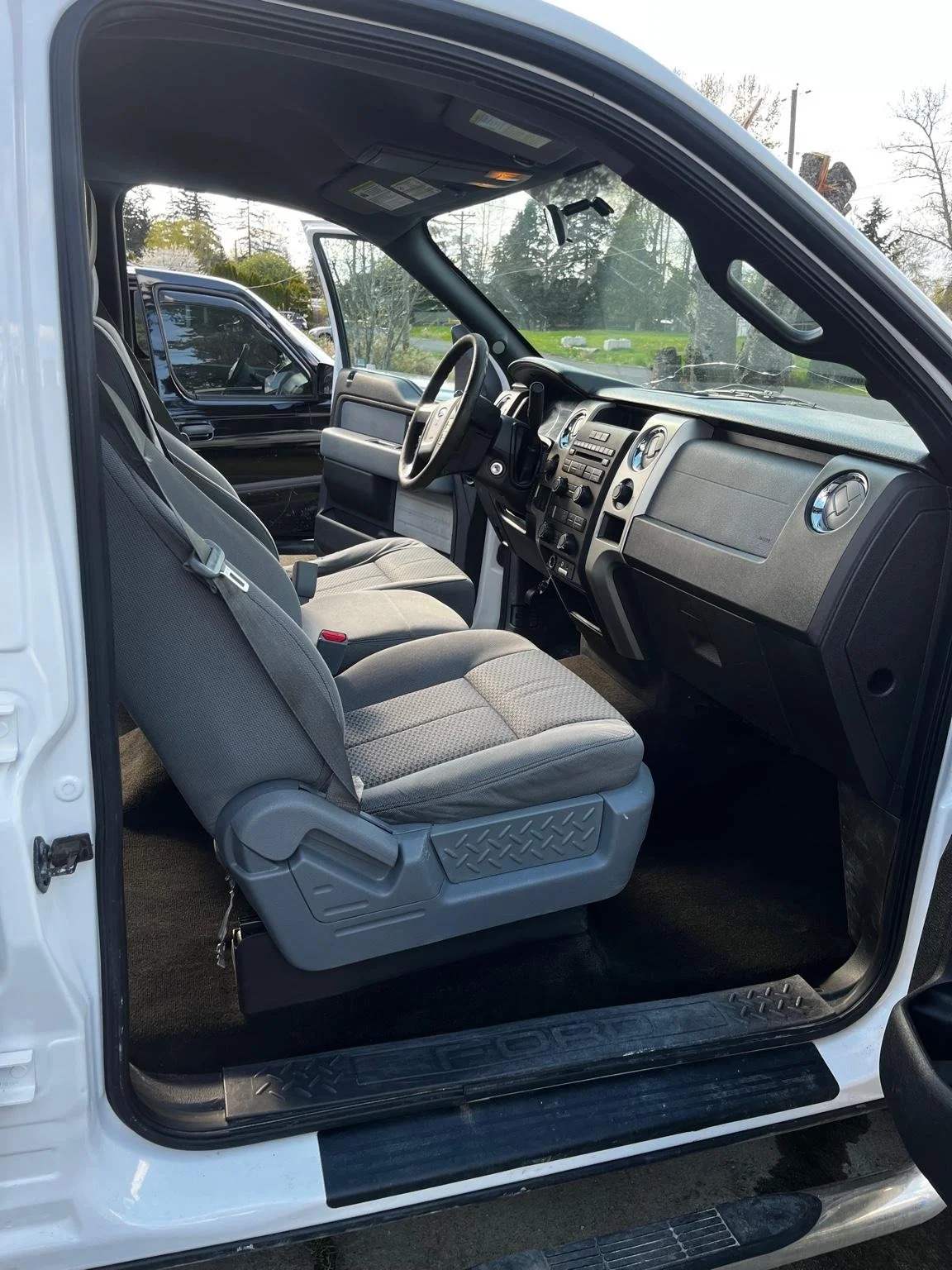 After restorative interior cleaning on Ford F150 work truck - seats, carpets, and dashboard fully deep cleaned and restored from heavy dirt and debris.