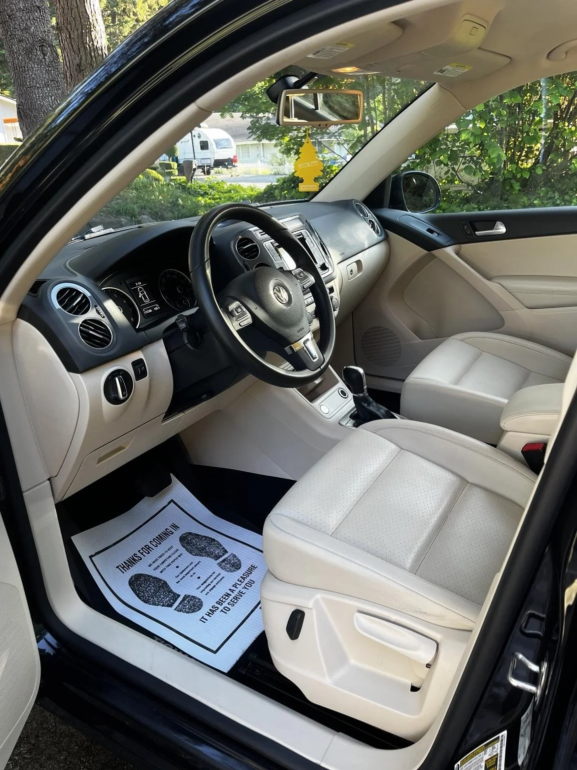 Volkswagen Tiguan interior detailing completed by Bryanz Auto Detailing with deep cleaned white leather seats and restored interior finish.