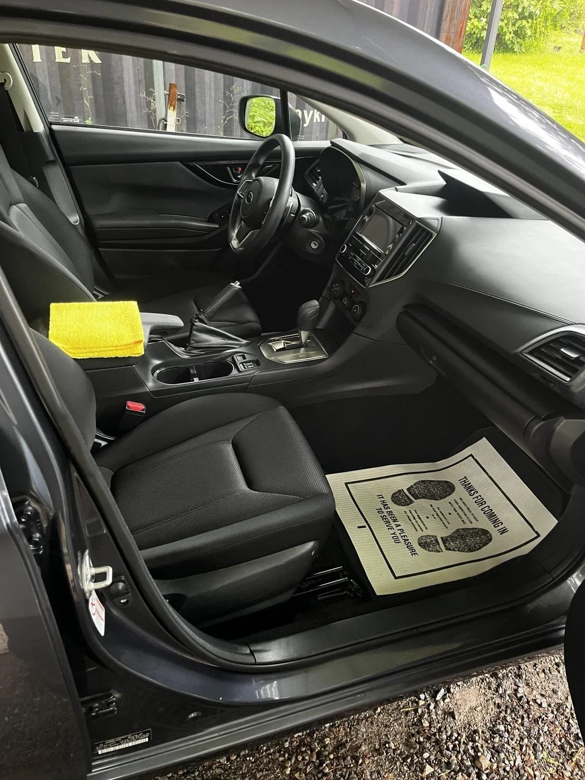 Front cabin interior detailing service in Graham WA featuring a professionally cleaned Subaru dashboard, center console, passenger seat, and floor mats by Bryanz Auto Detailing