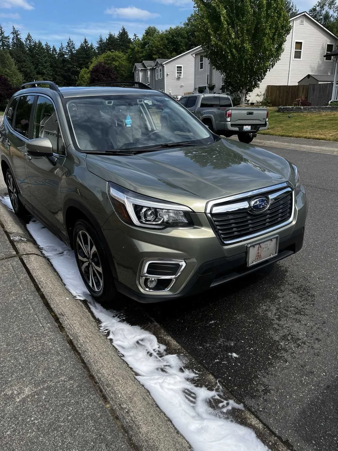 Professional wash and wax car detailing service in Maple Valley WA on a Subaru Forester with a clean glossy finish